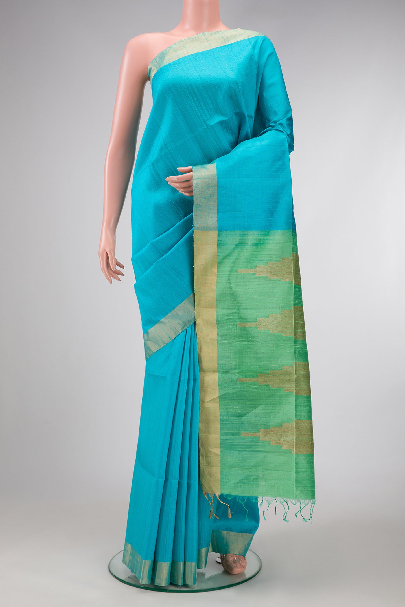 Sky Blue Dual Tone Raw Silk Saree with Plain Body and Zari Border.  displayed on a mannequin
