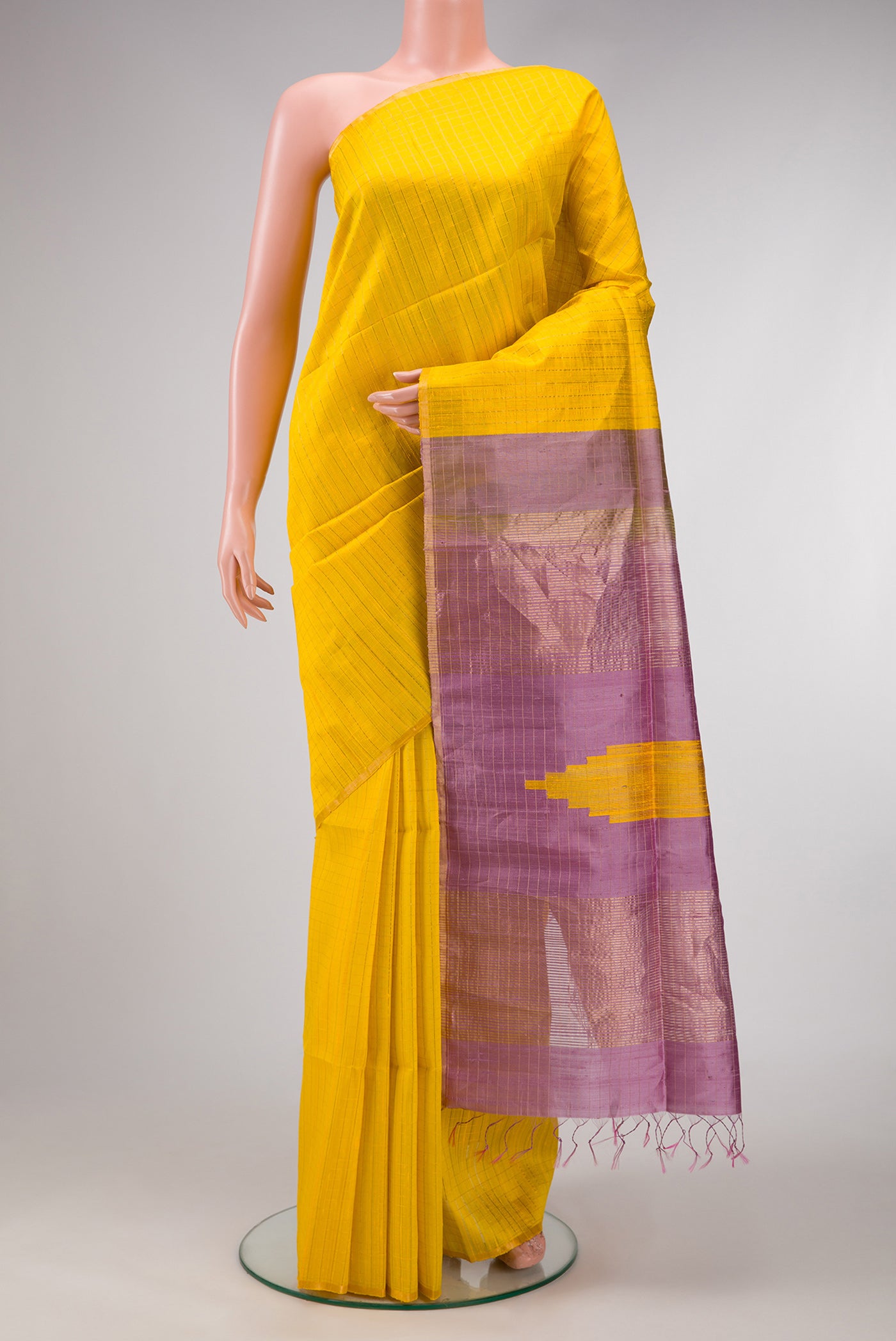 Yellow Dual Tone Raw Silk Saree with Checked design on the body and Thin Zari Line.  displayed on a mannequin