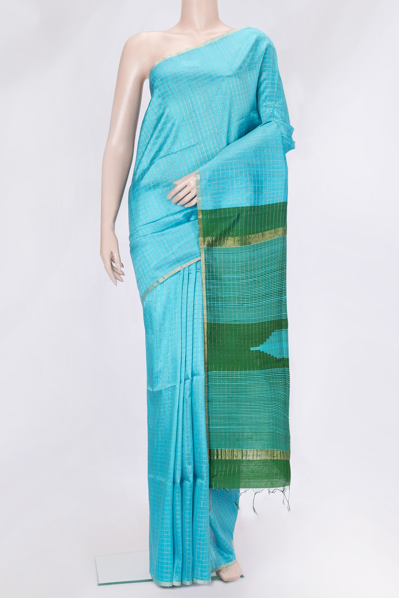 Sky Blue Dual Tone Raw Silk Saree with Checked design on the body and Zari Border.  displayed on a mannequin