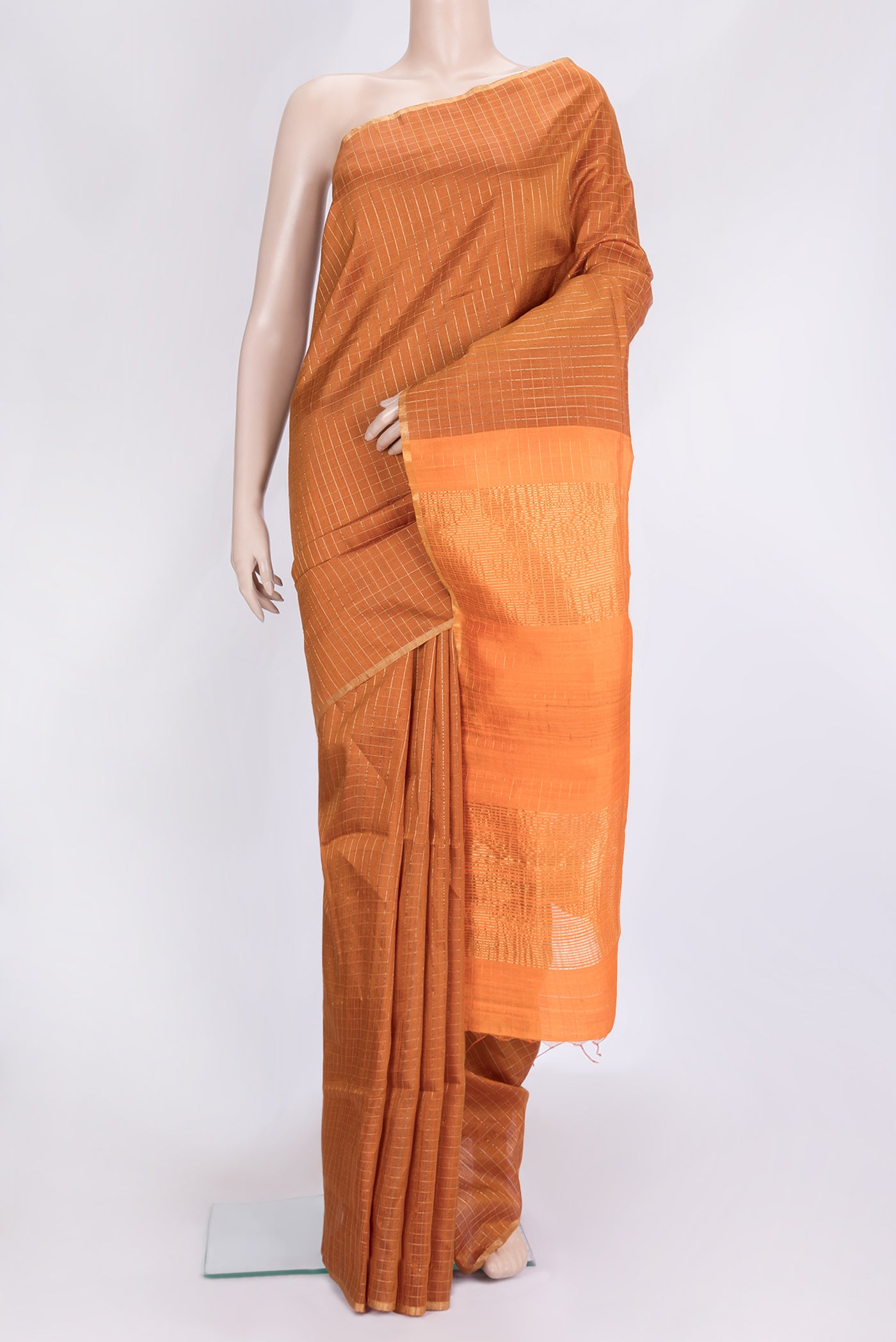 Bronze Dual Tone Raw Silk Saree with Checked design on the body and Thin Zari Line.  displayed on a mannequin