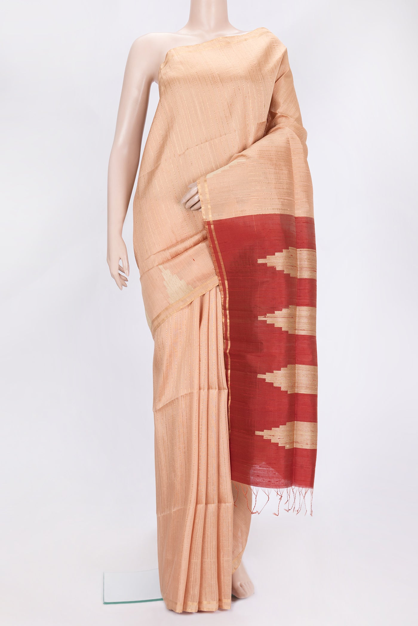 Golden Peach Dual Tone Raw Silk Saree with Stripes on the body and Temple Border.  displayed on a mannequin