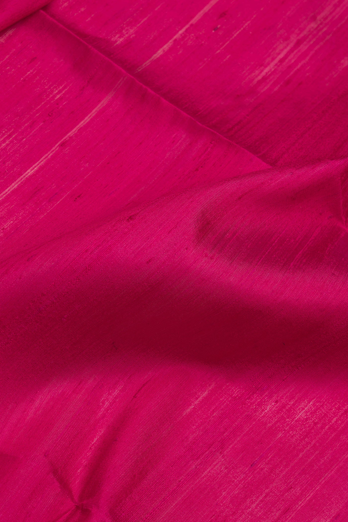 Close up of Pink Dual Tone Raw Silk Saree with Plain Body and Thin Zari Line.  displaying folds
