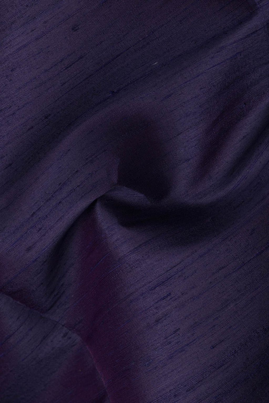 Close up of Navy Blue Dual Tone Raw Silk Saree with Plain Body and Plain Border.  displaying folds
