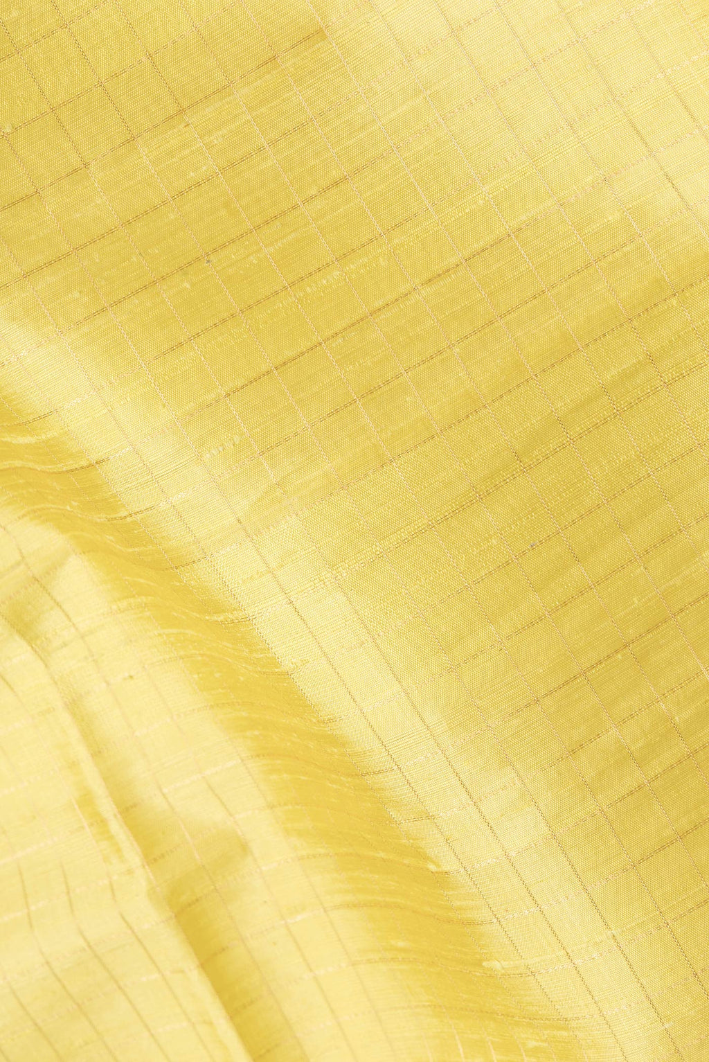 Close up of Lemon Yellow Dual Tone Raw Silk Saree with Checked design on the body and Zari Border.  displaying folds