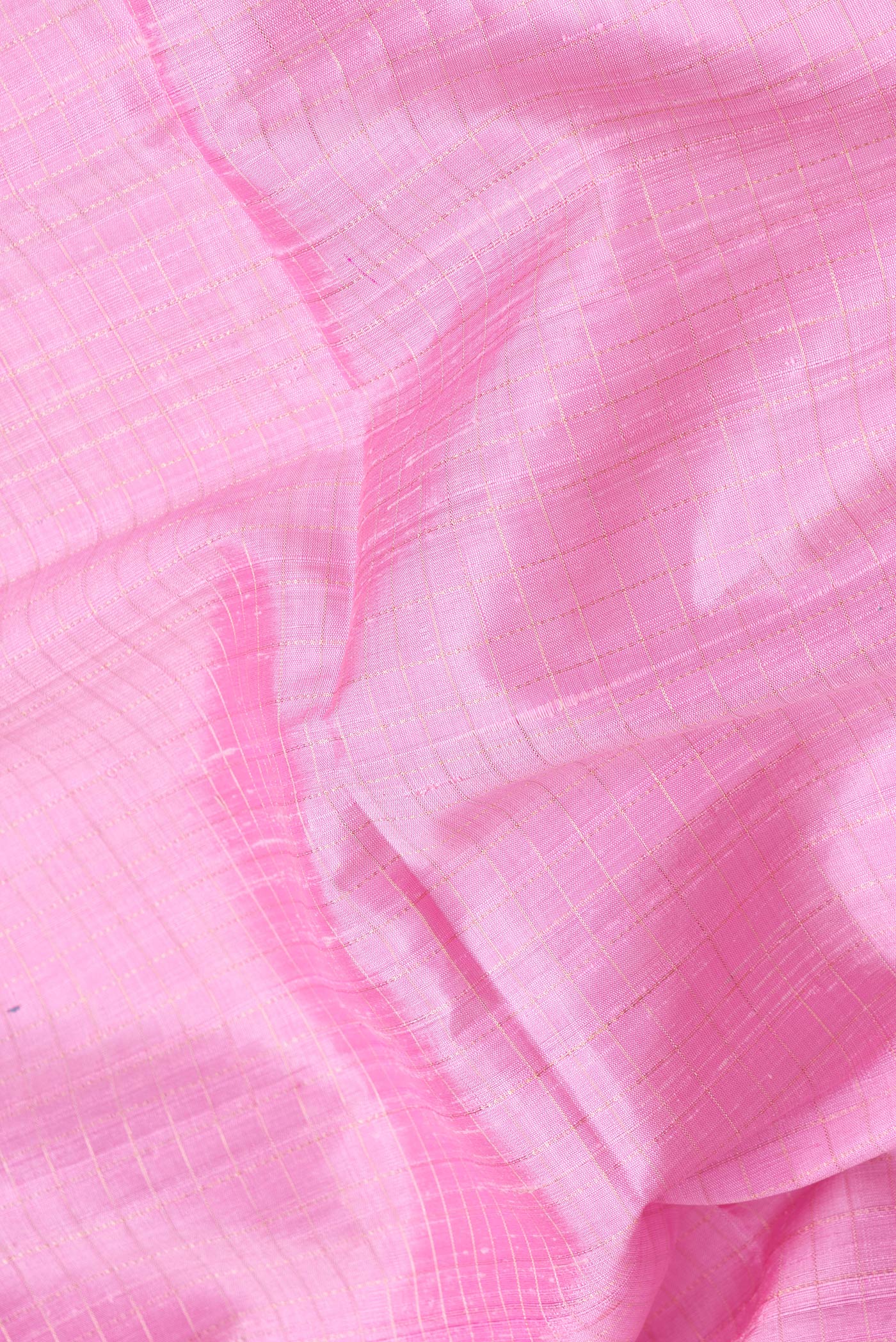 Close up of Pink Dual Tone Raw Silk Saree with Checked design on the body and Thin Zari Line.  displaying folds