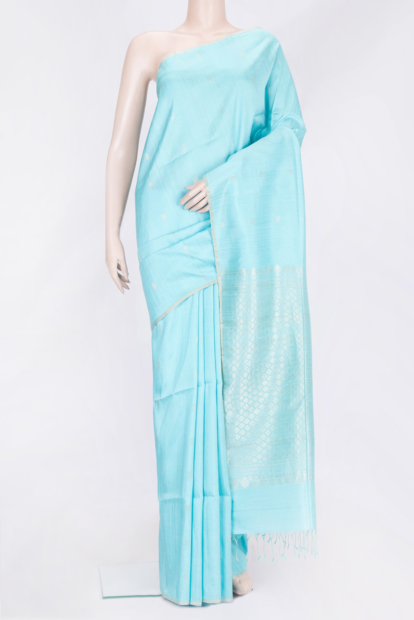 Sky Blue Dual Tone Raw Silk Saree with Zari Butta on the body and Zari Border.  displayed on a mannequin