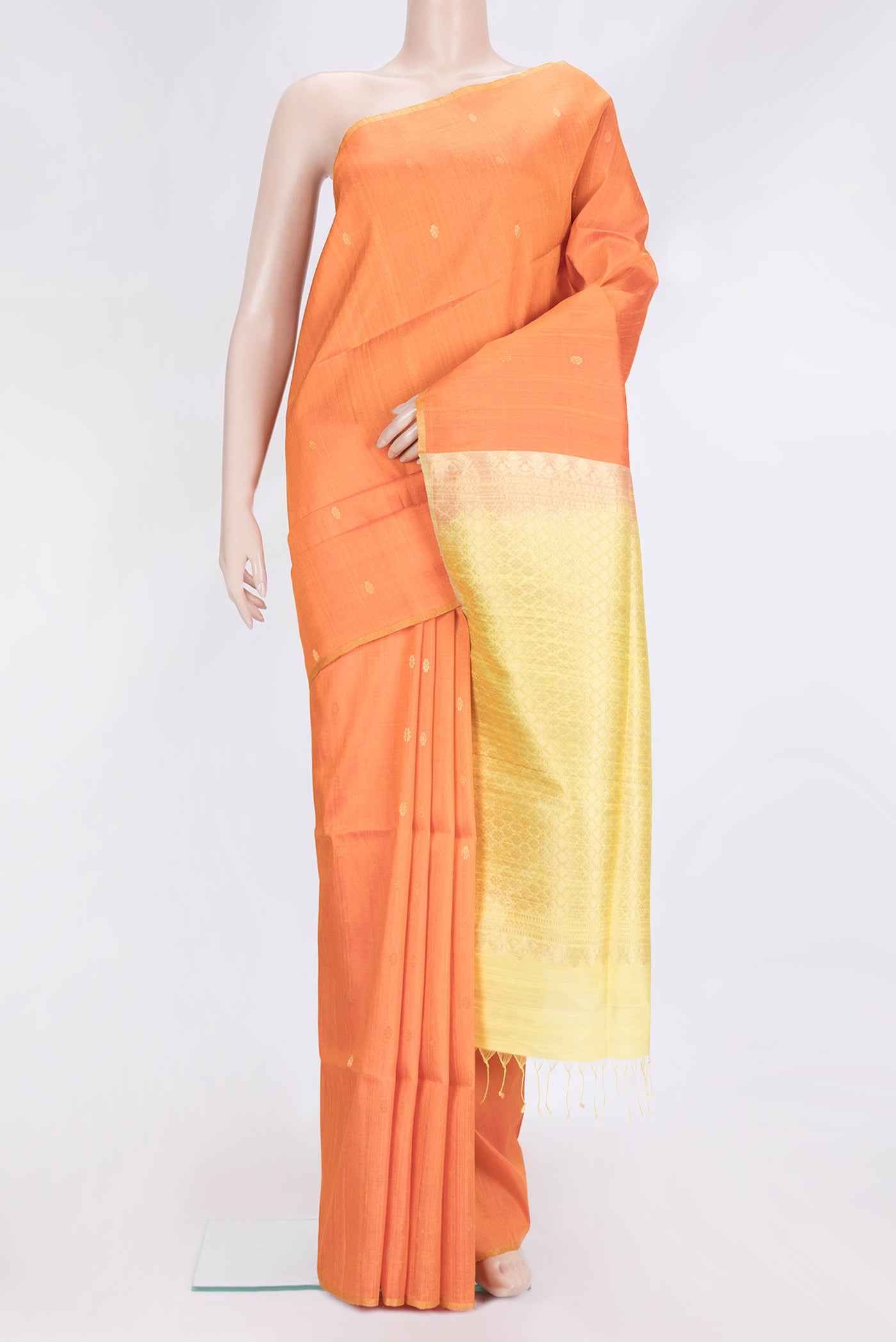 Orange Dual Tone Raw Silk Saree with Zari Butta on the body and Zari Border.  displayed on a mannequin