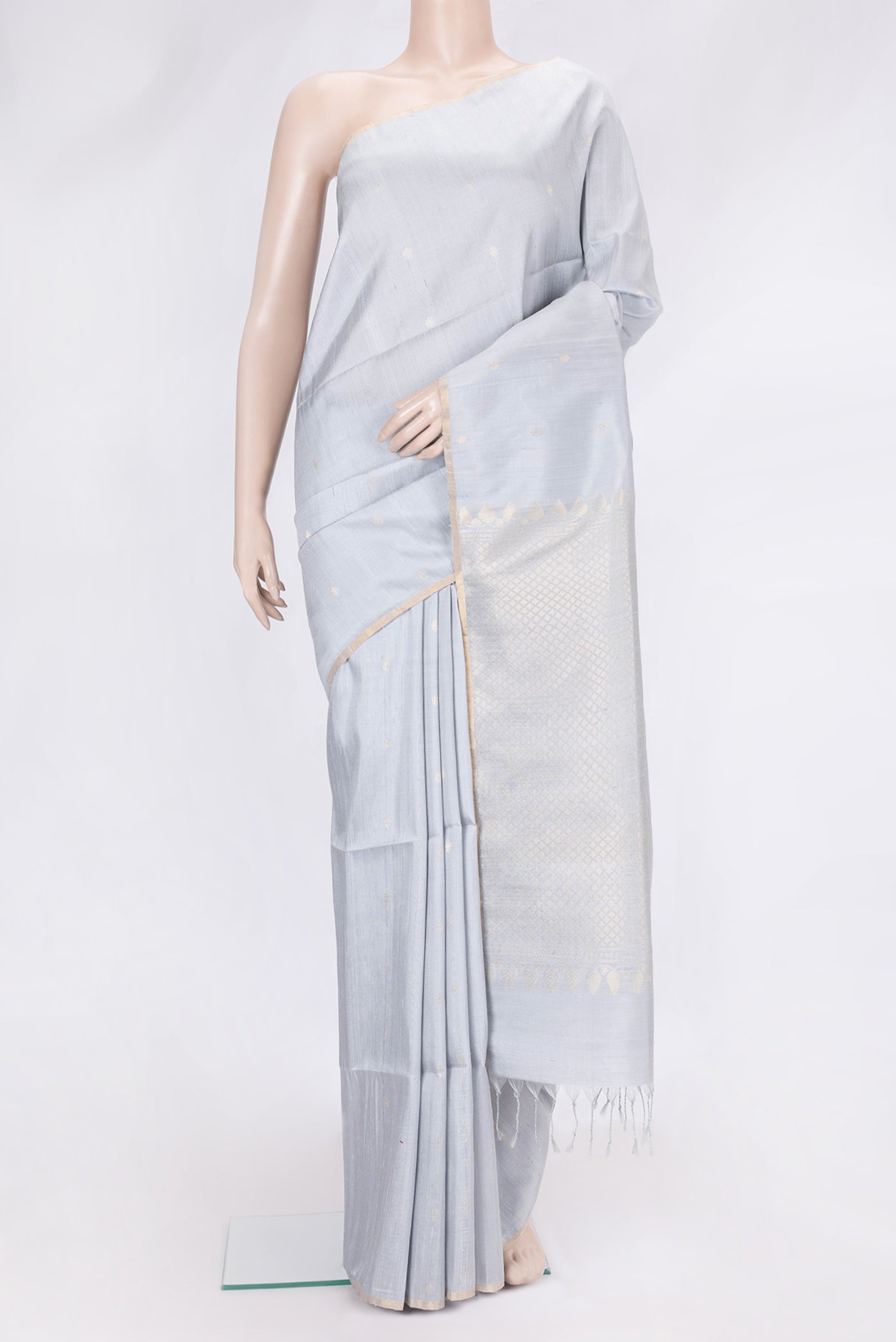 Grey Dual Tone Raw Silk Saree with Zari Butta on the body and Zari Border.  displayed on a mannequin
