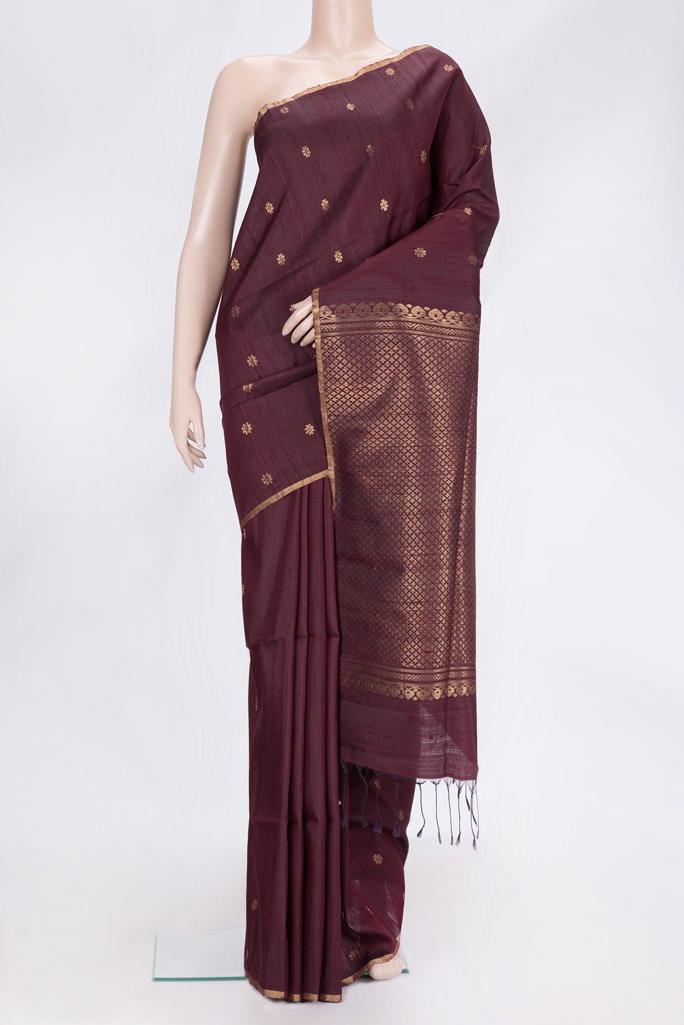 Brown Dual Tone Raw Silk Saree with Zari Butta on the body and Zari Border.  displayed on a mannequin