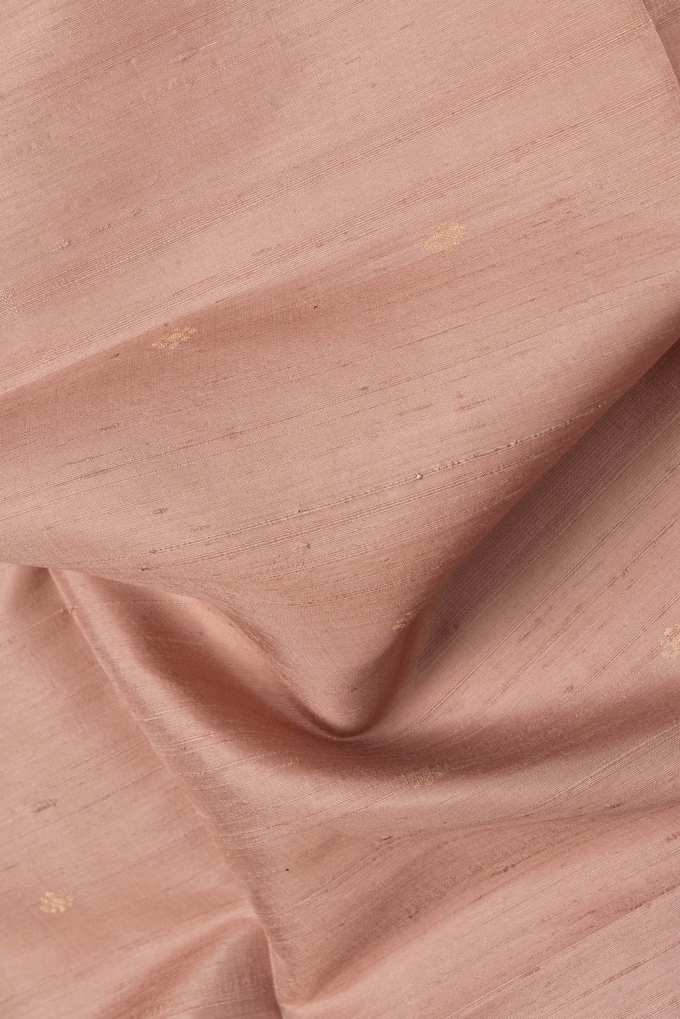 Close up of Dark Beige Dual Tone Raw Silk Saree with Zari Butta on the body and Thin Zari Line.  displaying folds