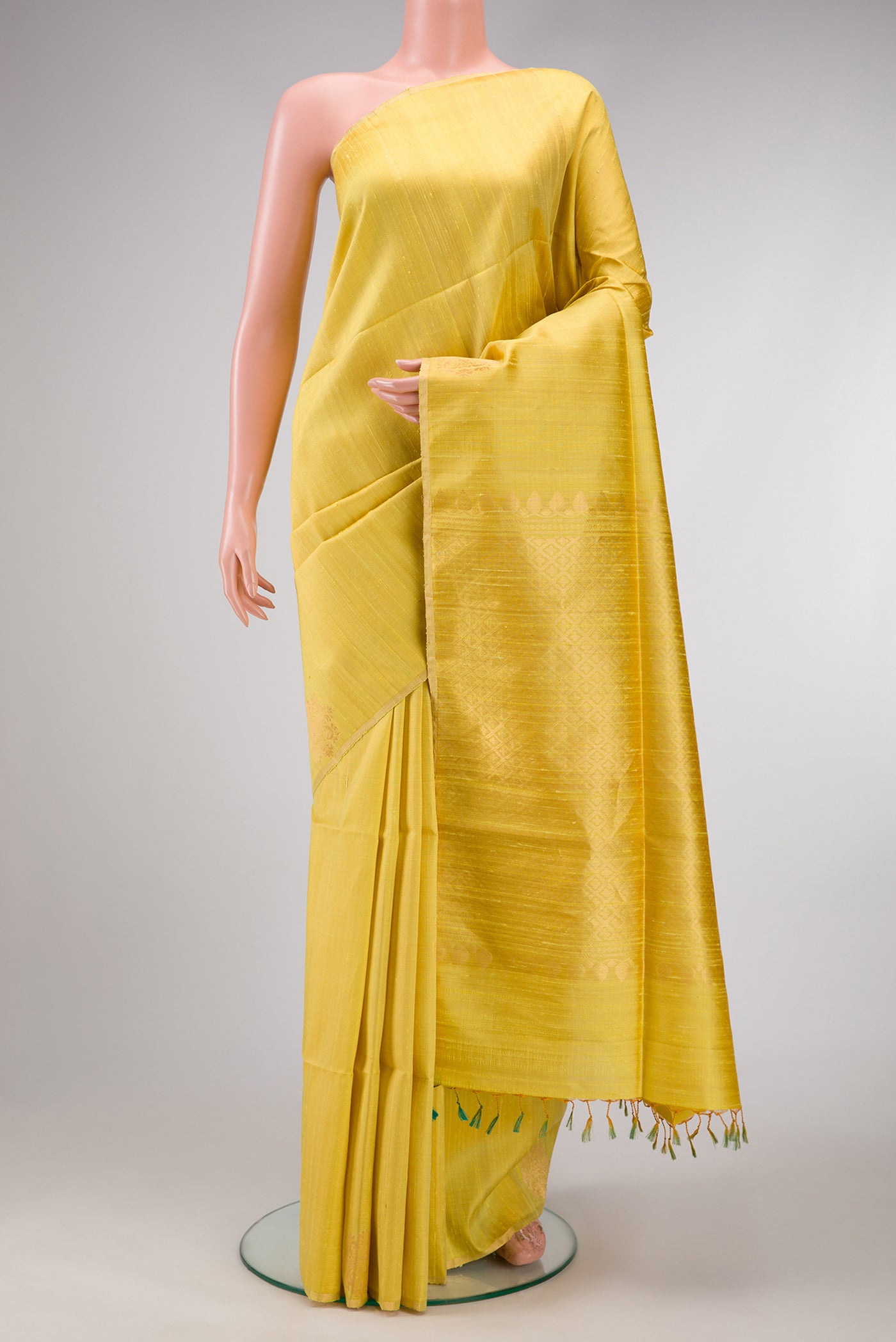 Lemon Yellow Dual Tone Raw Silk Saree with Plain Body and Fancy Border.  displayed on a mannequin