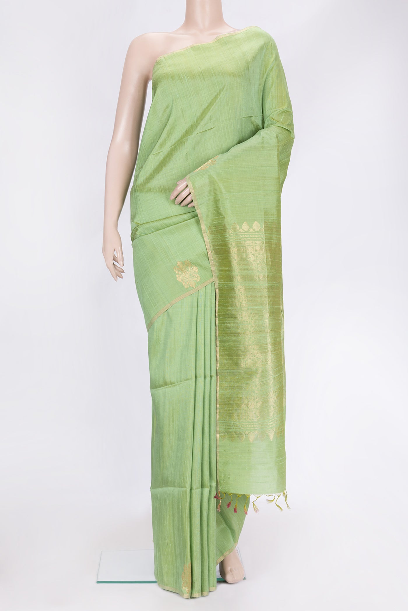 Pista Green Dual Tone Raw Silk Saree with Plain Body and Fancy Border.  displayed on a mannequin