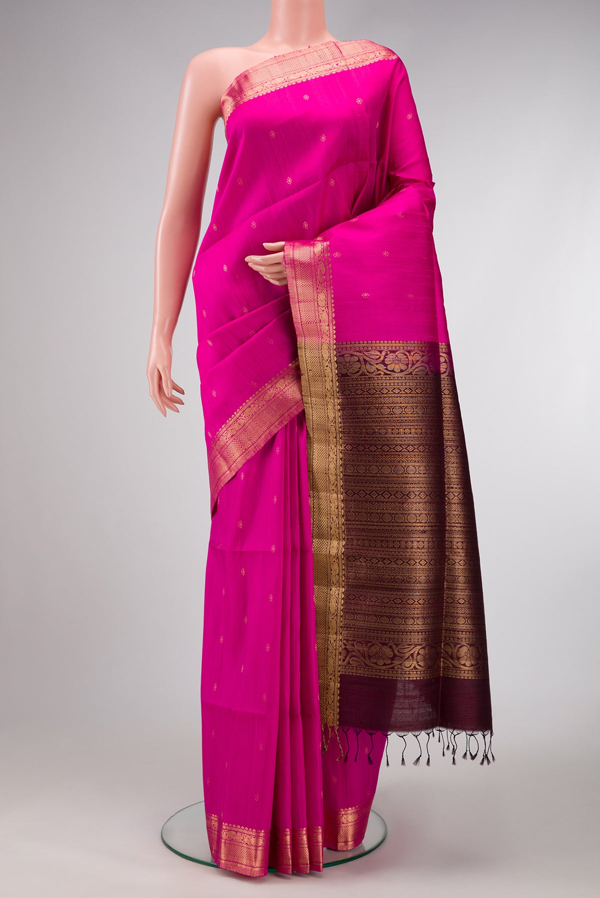 Magenta Dual Tone Raw Silk Saree with Zari Butta on the body and Zari Border.  displayed on a mannequin