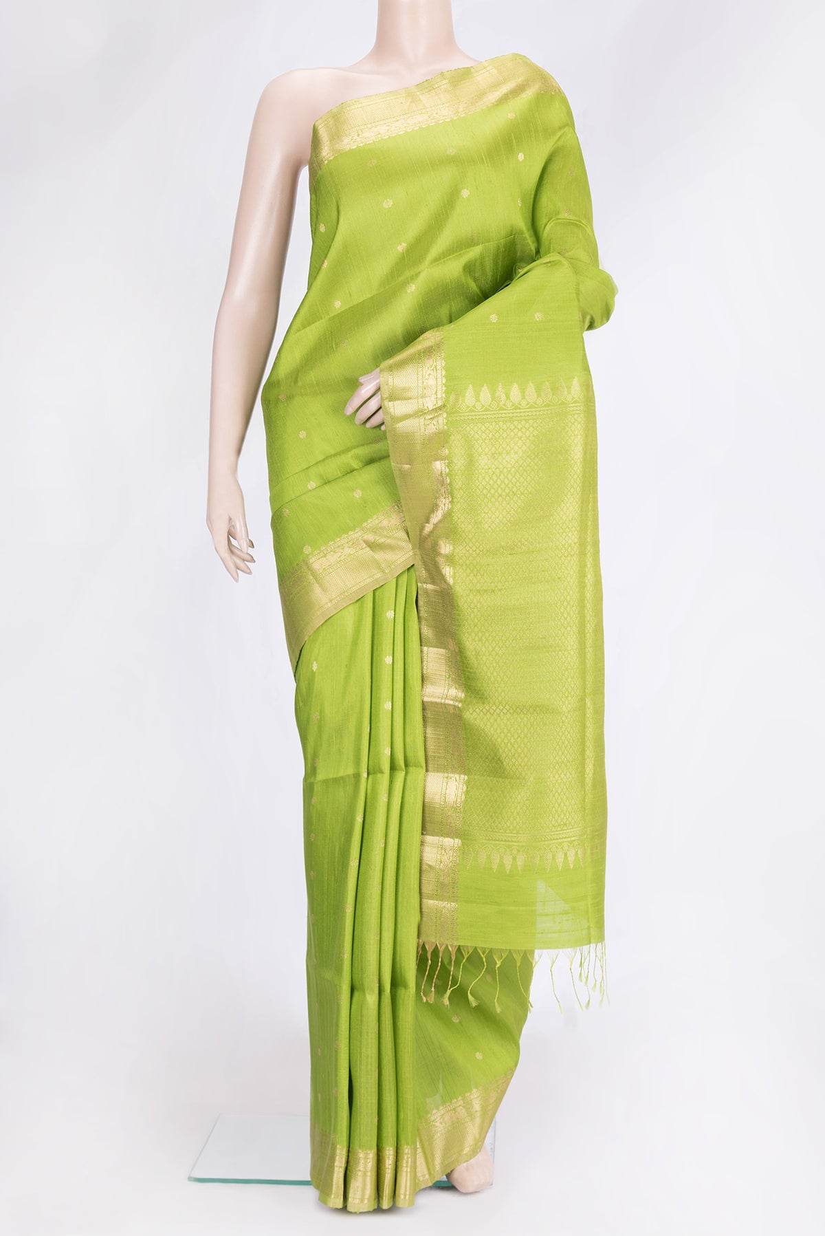 Parrot Green Dual Tone Raw Silk Saree with Zari Butta on the body and Zari Border.  displayed on a mannequin