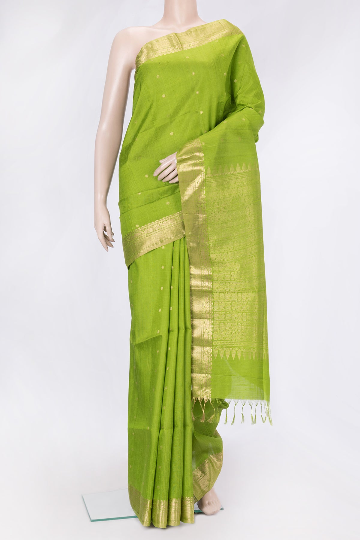 Parrot Green Dual Tone Raw Silk Saree with Plain Body and Zari Border.  displayed on a mannequin
