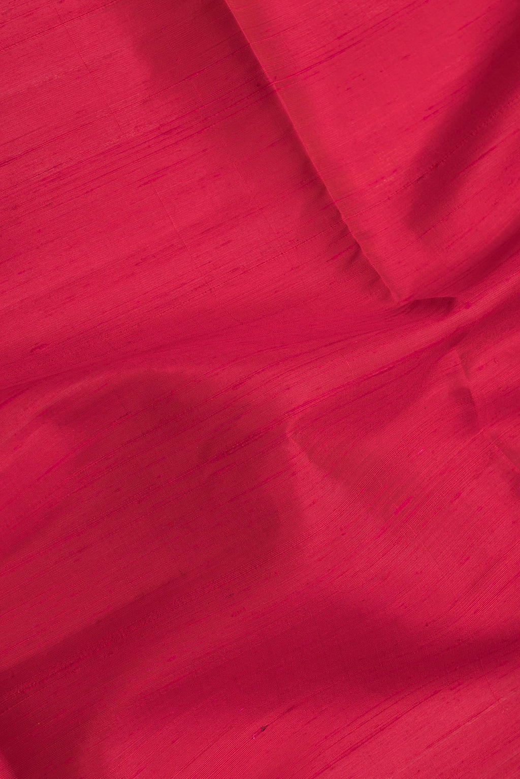 Close up of Dark Pink Dual Tone Raw Silk Saree with Plain Body and Zari Border.  displaying folds
