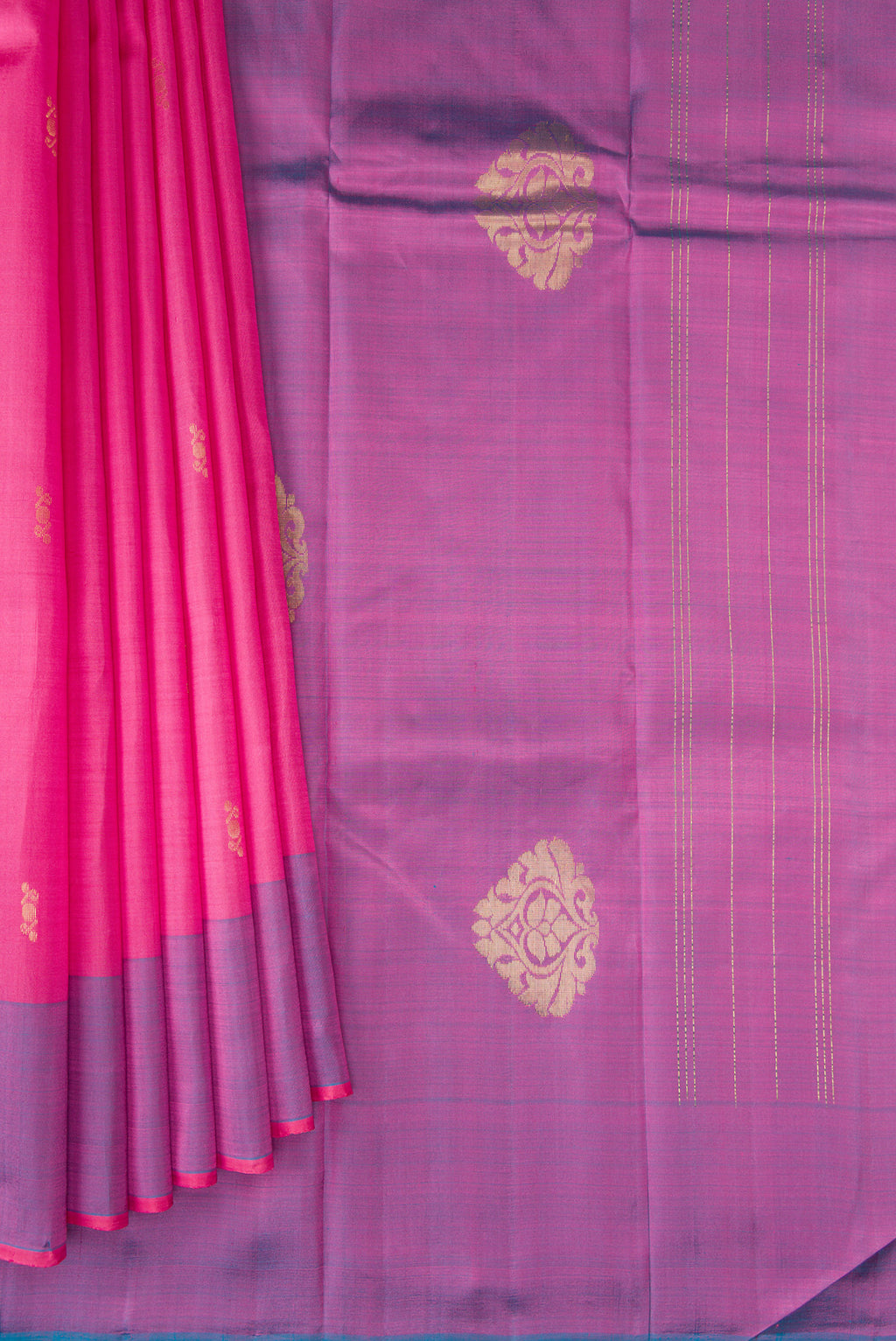 Pleats and pallu of Pink Kanchipuram Silk Saree with Zari Butta on the body and Zari Border. 