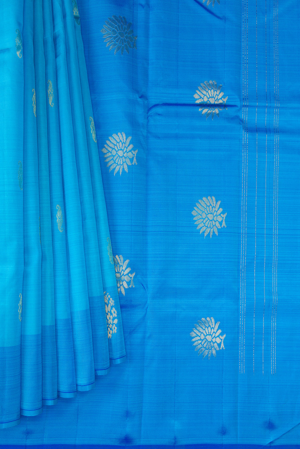 Pleats and pallu of Sky Blue Kanchipuram Silk Saree with Zari Butta on the body and Fancy Border. 