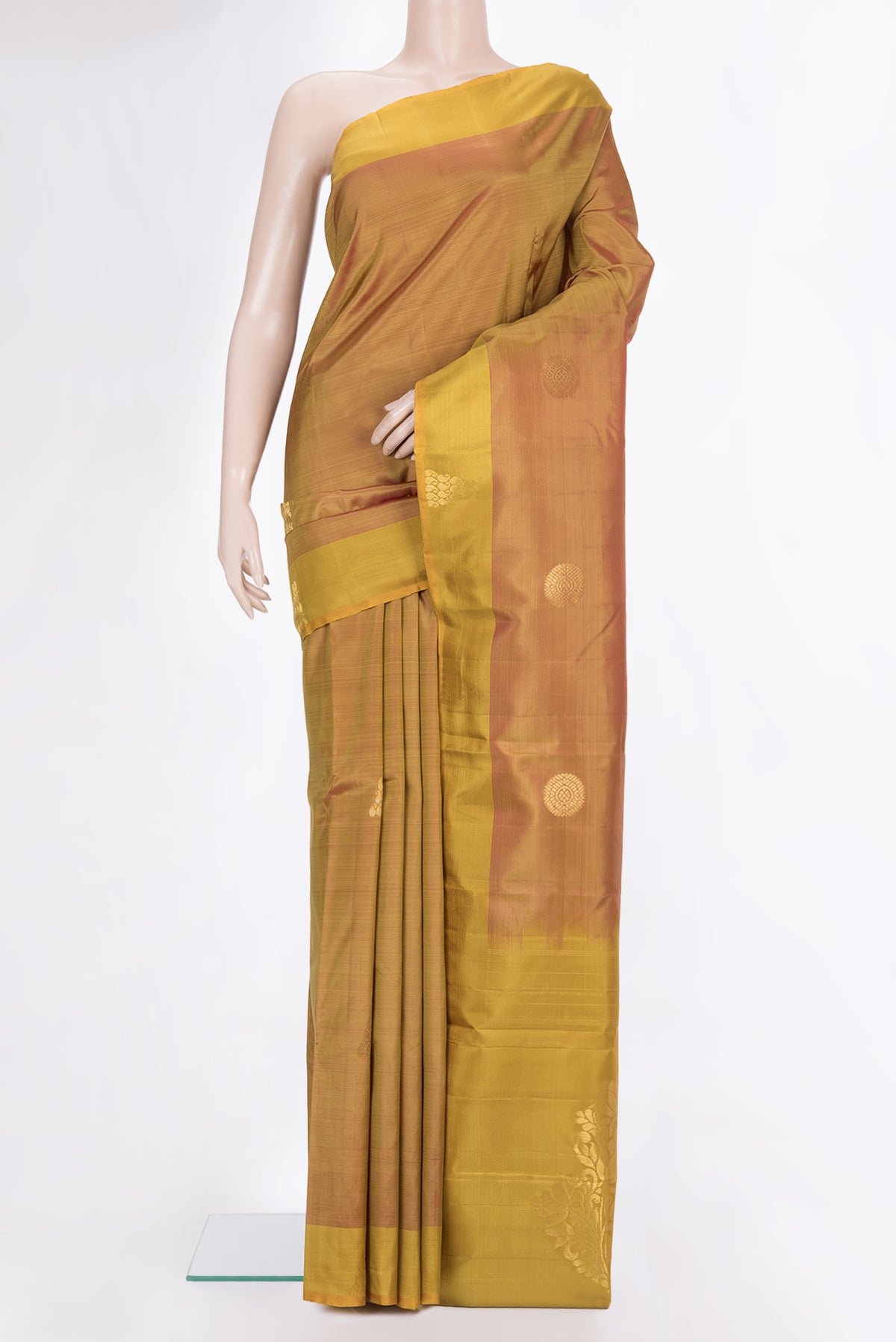 Pure Silk Rust with Mustard Color Kanchipuram Saree with Zari Butta on the body and Fancy Border.  displayed on a mannequin