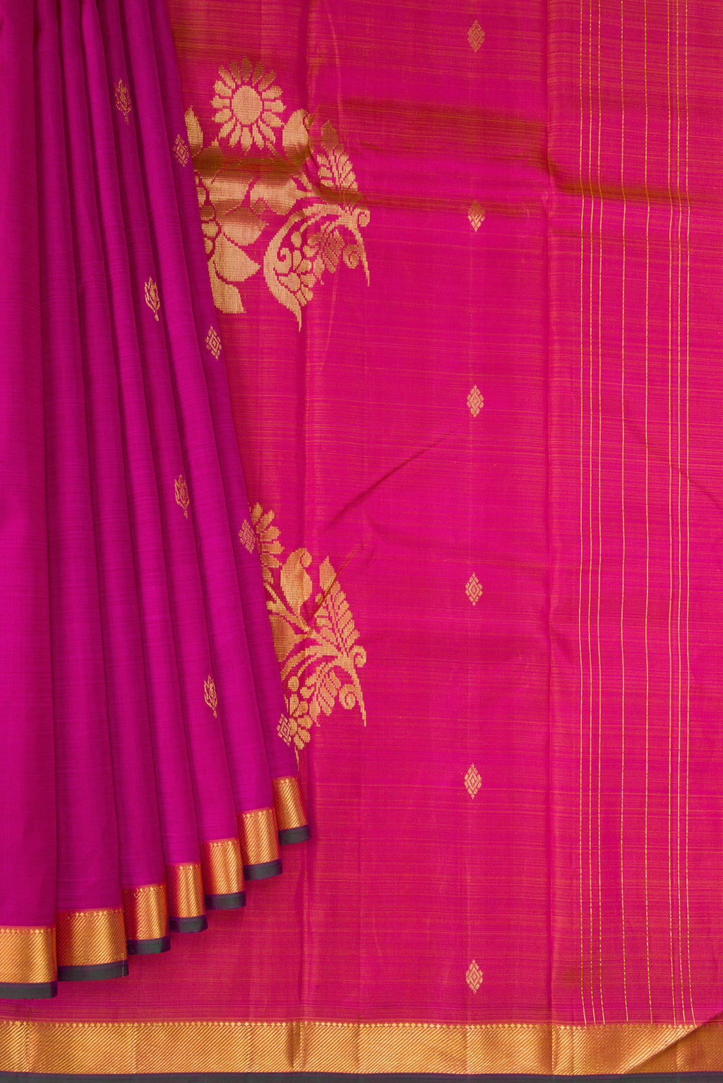 Pleats and pallu of Magenta Kanchipuram Silk Saree with Zari Butta on the body and Zari Border. 