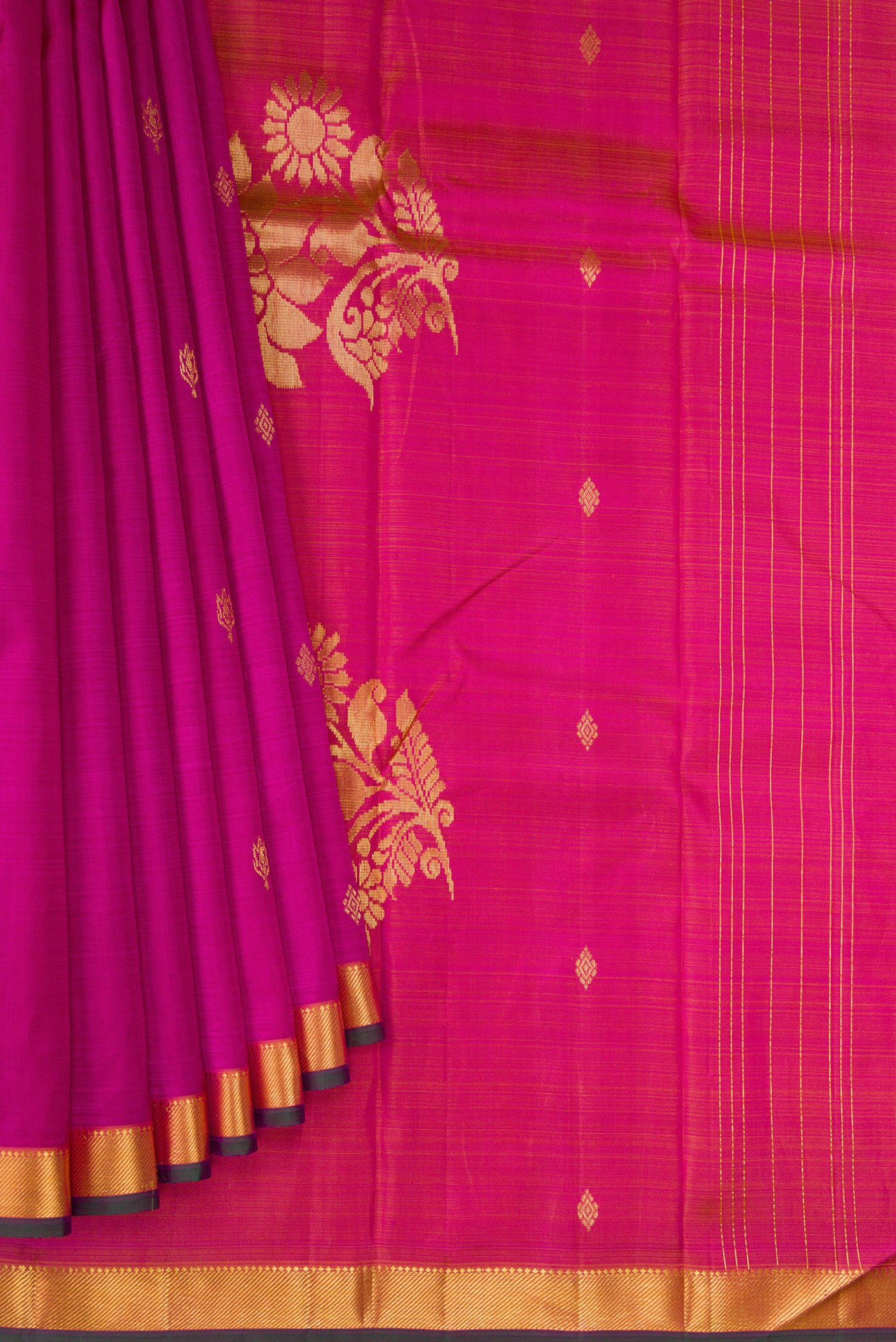 Pleats and pallu of Magenta Kanchipuram Silk Saree with Zari Butta on the body and Zari Border. 