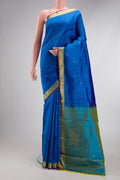 Royal Blue Kanchipuram Silk Saree with Zari Butta on the body and Zari Border.  displayed on a mannequin