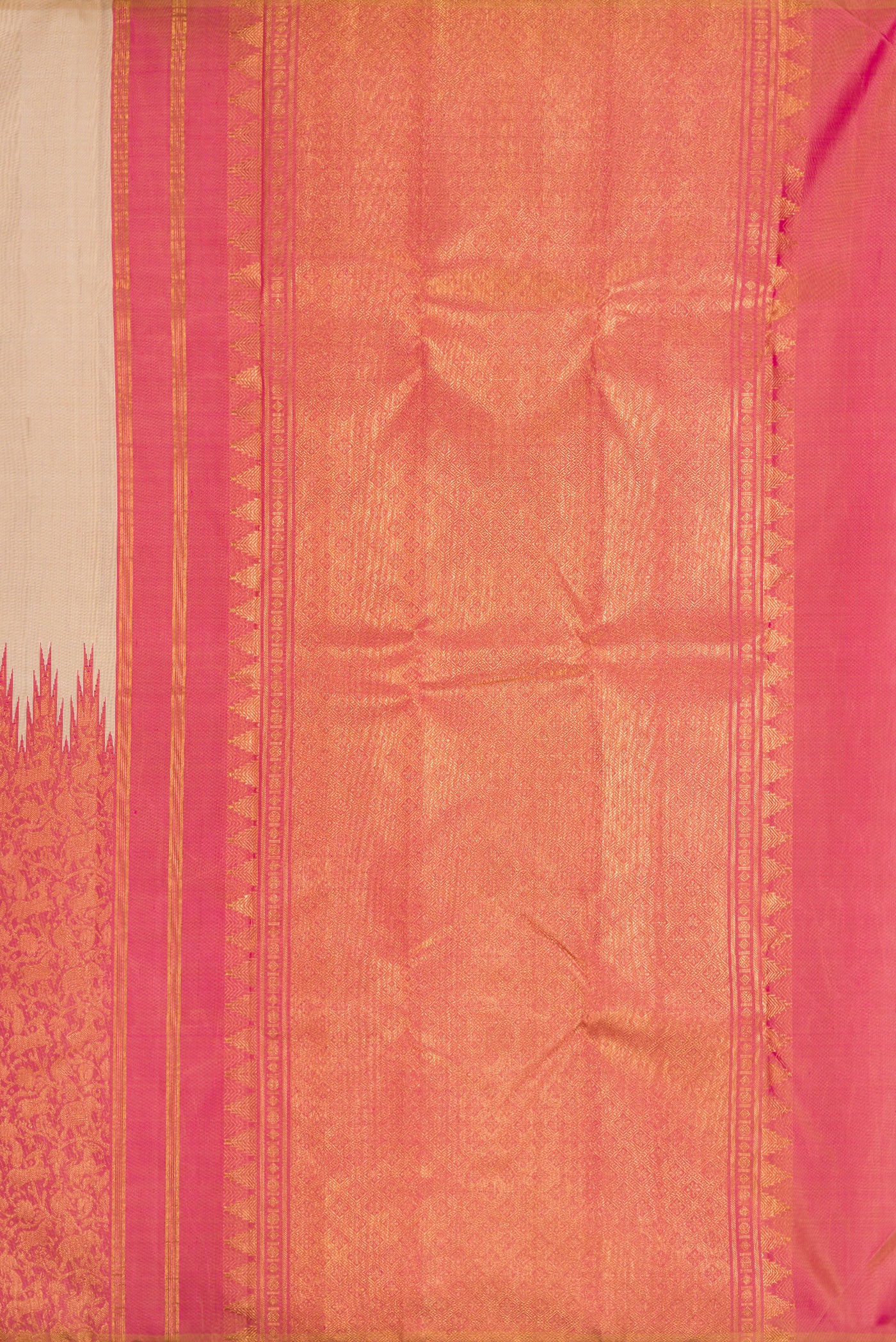 Close up image of the pallu of Beige Dual Tone Kanchipuram Silk Saree with Plain Body and Rising Temple Border. 