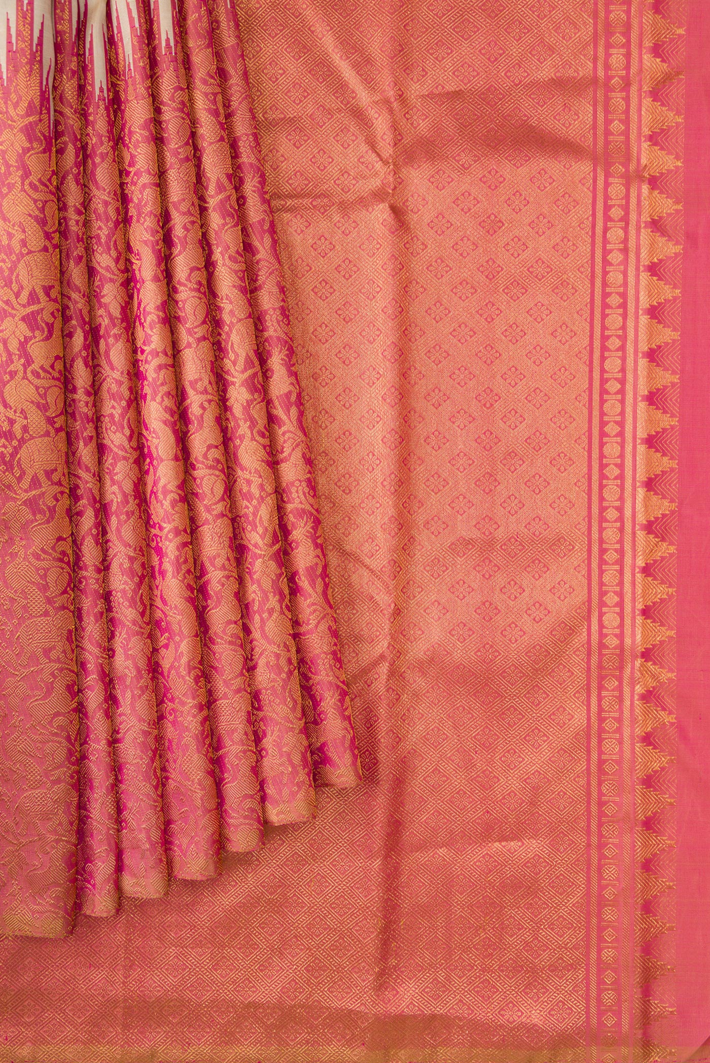 Pleats and pallu of Beige Dual Tone Kanchipuram Silk Saree with Plain Body and Rising Temple Border. 