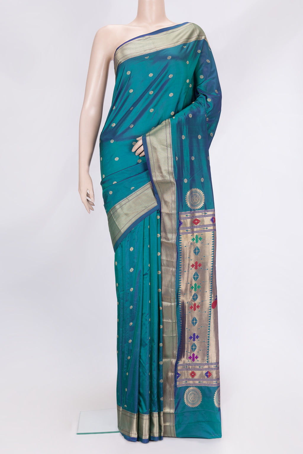 Peacock Blue Dual Tone Paithani Silk Saree with Zari Butta on the body and Zari Border.  displayed on a mannequin