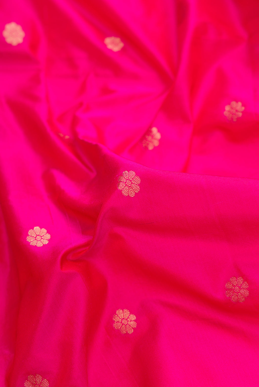 Close up of Pink Dual Tone Blended Paithani Silk Saree with Zari Butta on the body and Zari Border.  displaying folds