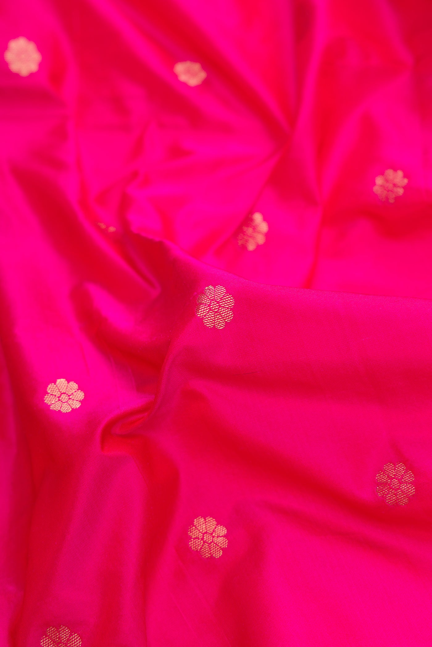 Close up of Pink Dual Tone Blended Paithani Silk Saree with Zari Butta on the body and Zari Border.  displaying folds
