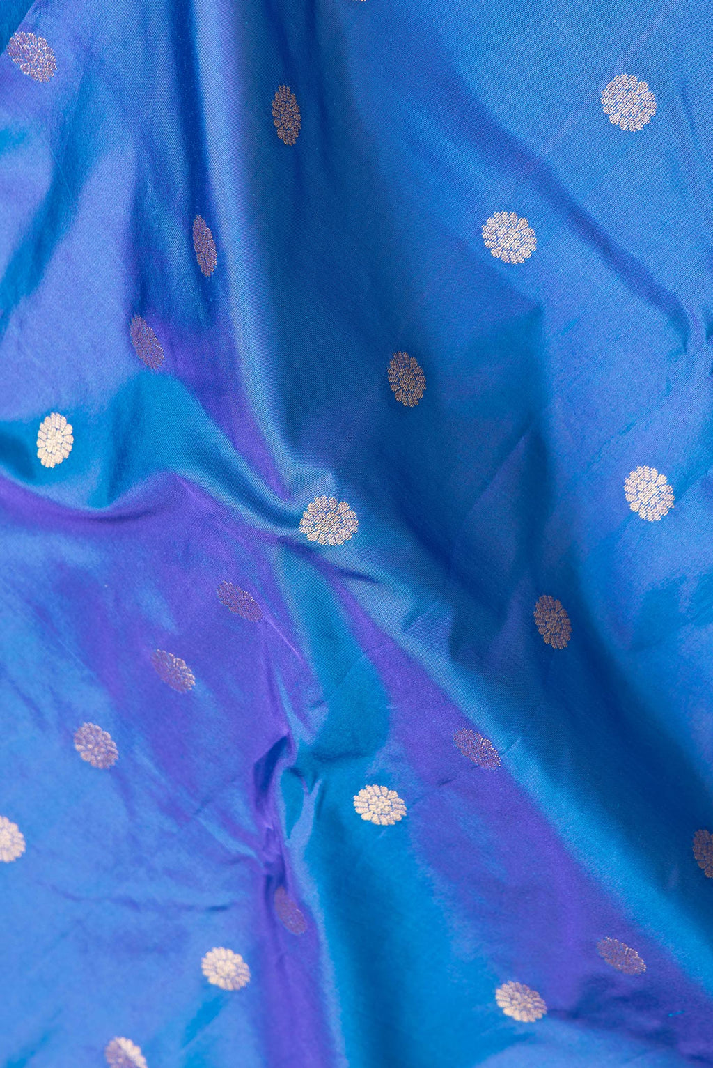 Close up of Peacock Blue Dual Tone Blended Paithani Silk Saree with Zari Butta on the body and Zari Border.  displaying folds
