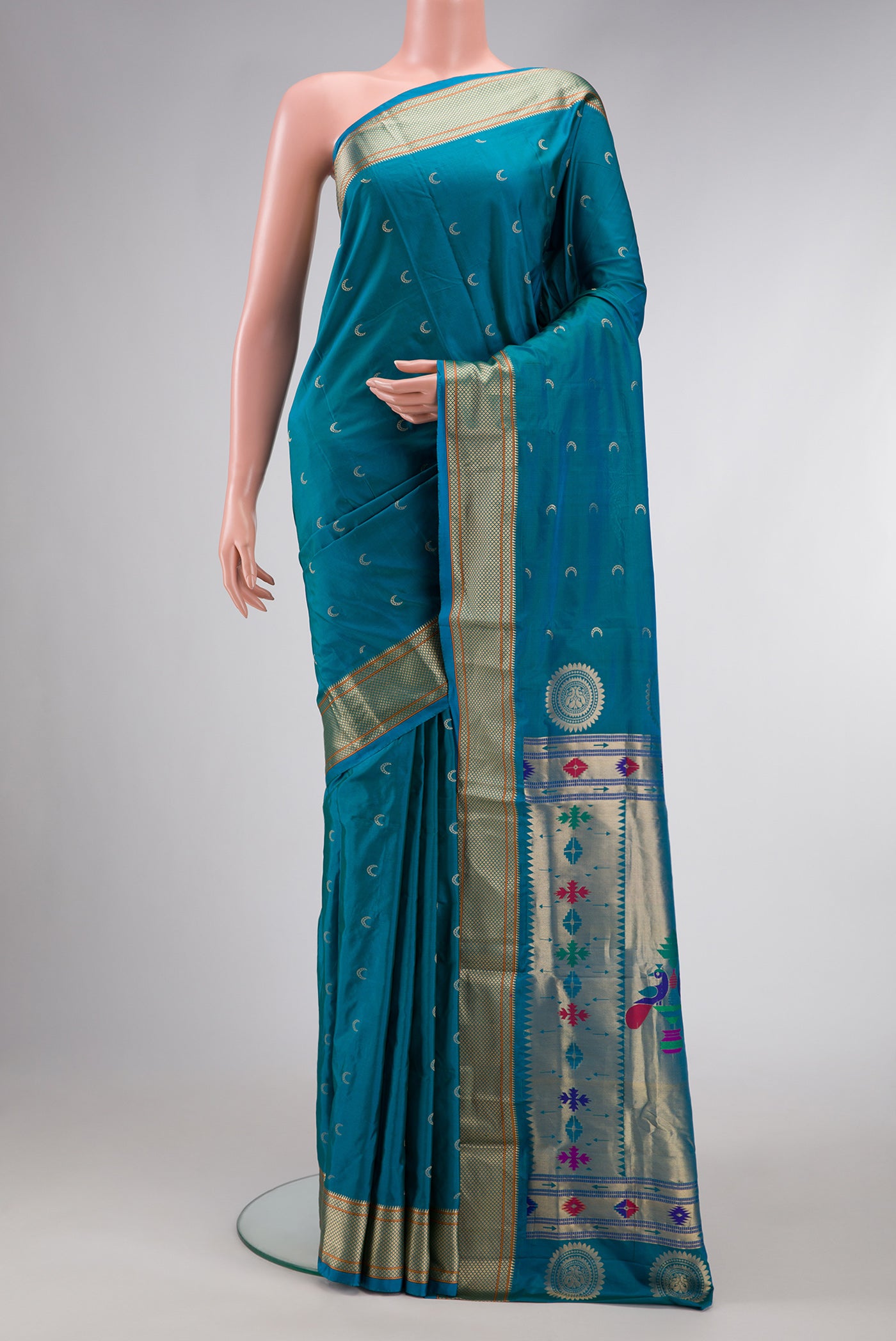 Sky Blue Dual Tone Blended Paithani Silk Saree with Zari Butta on the body and Zari Border.  displayed on a mannequin