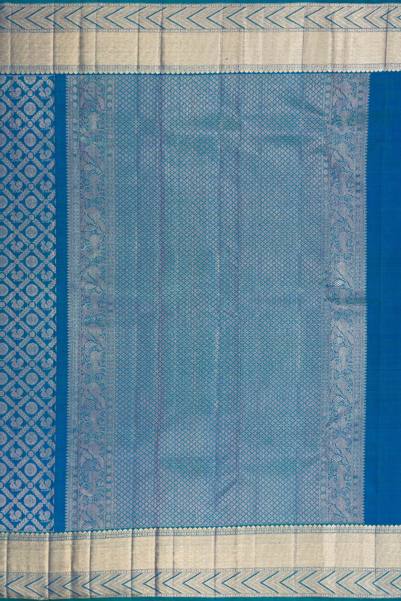 Close up image of the pallu of Peacock Blue Dual Tone Kanchipuram Silk Saree with Zari Brocade on the body and Zari Border. 
