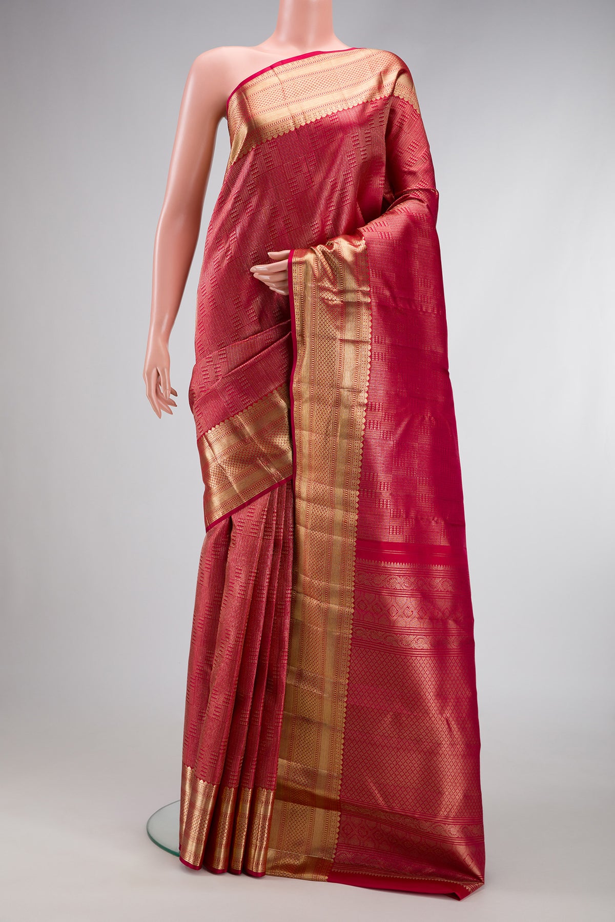 Dark Pink Dual Tone Kanchipuram Silk Saree with Zari Brocade on the body and Zari Border.  displayed on a mannequin