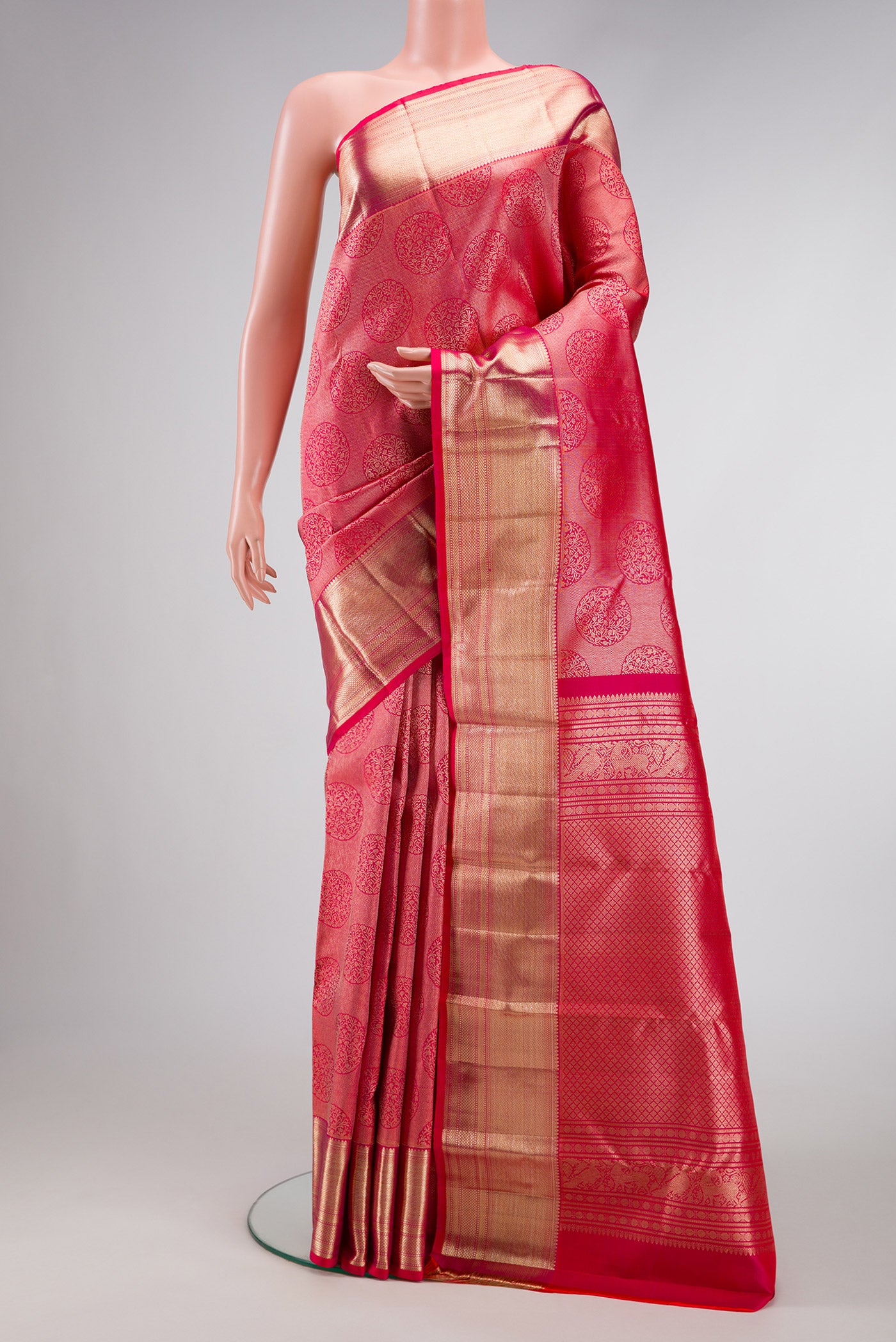 Pink Dual Tone Kanchipuram Silk Saree with Zari Brocade on the body and Zari Border.  displayed on a mannequin