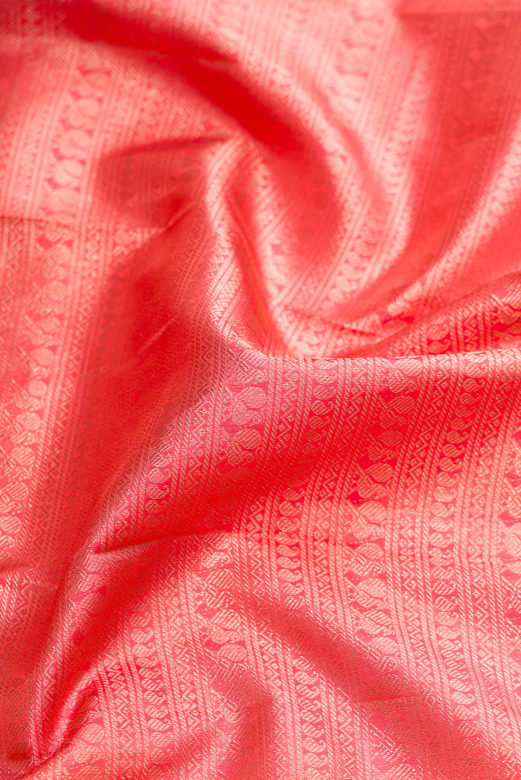 Close up of Pink Dual Tone Kanchipuram Silk Saree with Zari Brocade on the body and Zari Border.  displaying folds