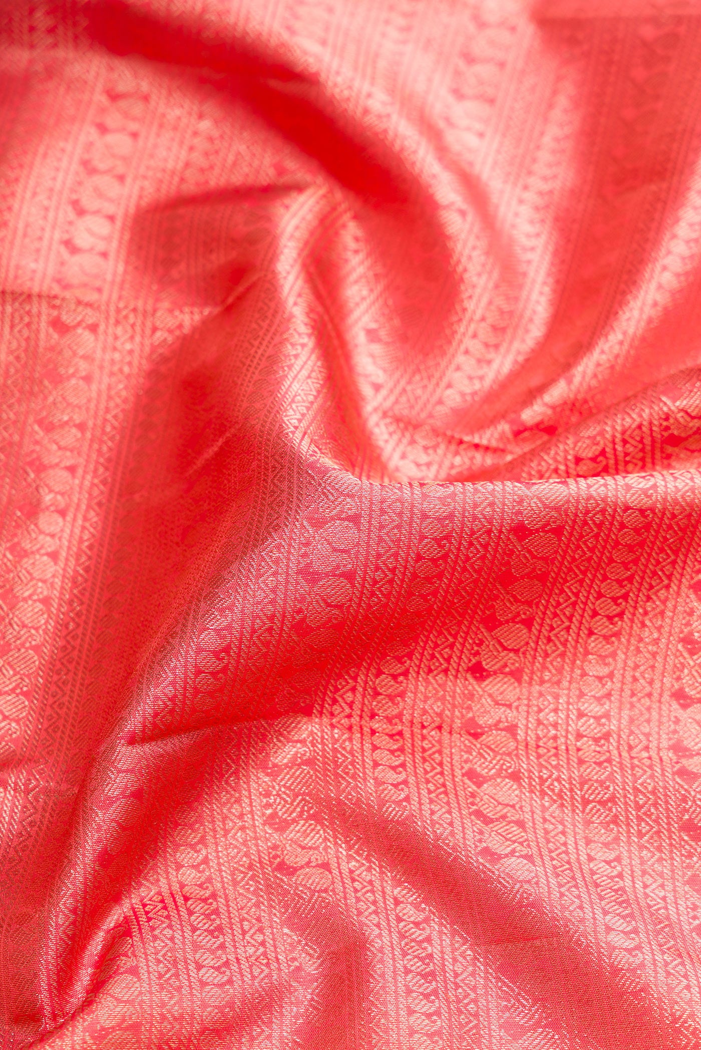 Close up of Pink Dual Tone Kanchipuram Silk Saree with Zari Brocade on the body and Zari Border.  displaying folds