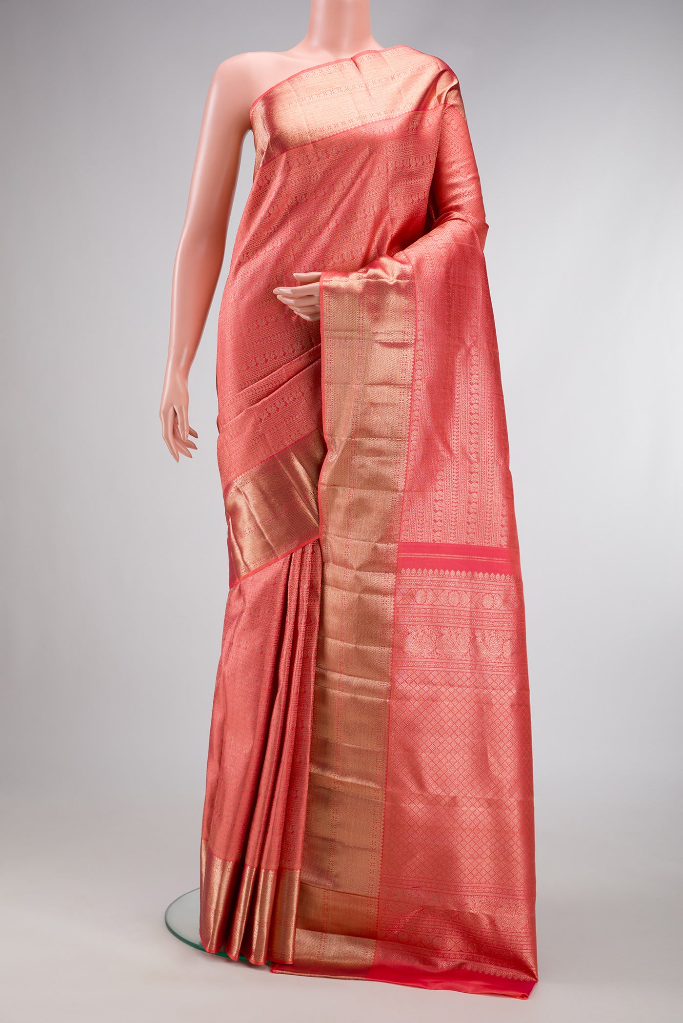 Pink Dual Tone Kanchipuram Silk Saree with Zari Brocade on the body and Zari Border.  displayed on a mannequin