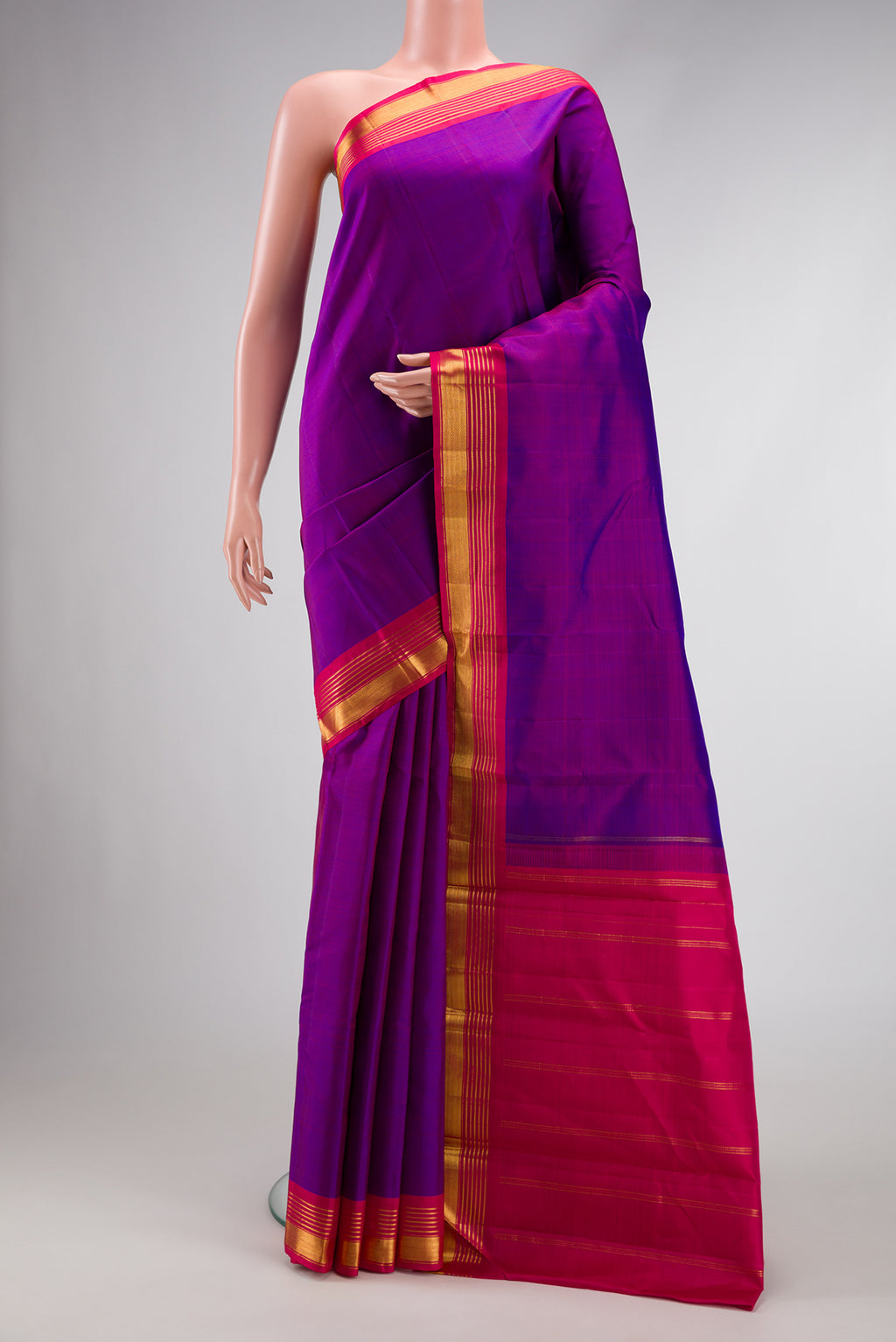 Purple Dual Tone Kanjivaram Silk Saree with Plain Body and Zari Border.  displayed on a mannequin