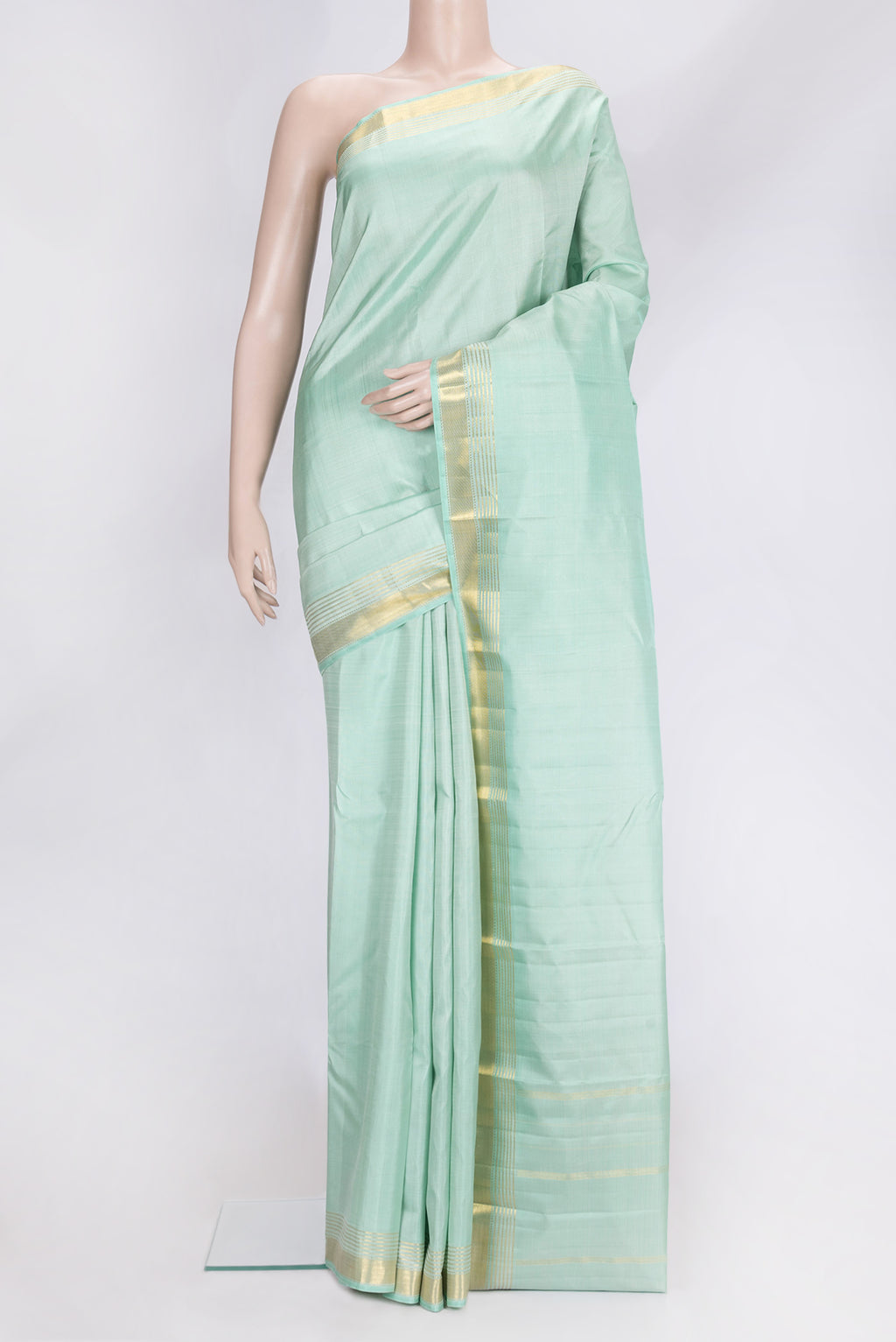 Sea Green Dual Tone Kanjivaram Silk Saree with Plain Body and Zari Border.  displayed on a mannequin