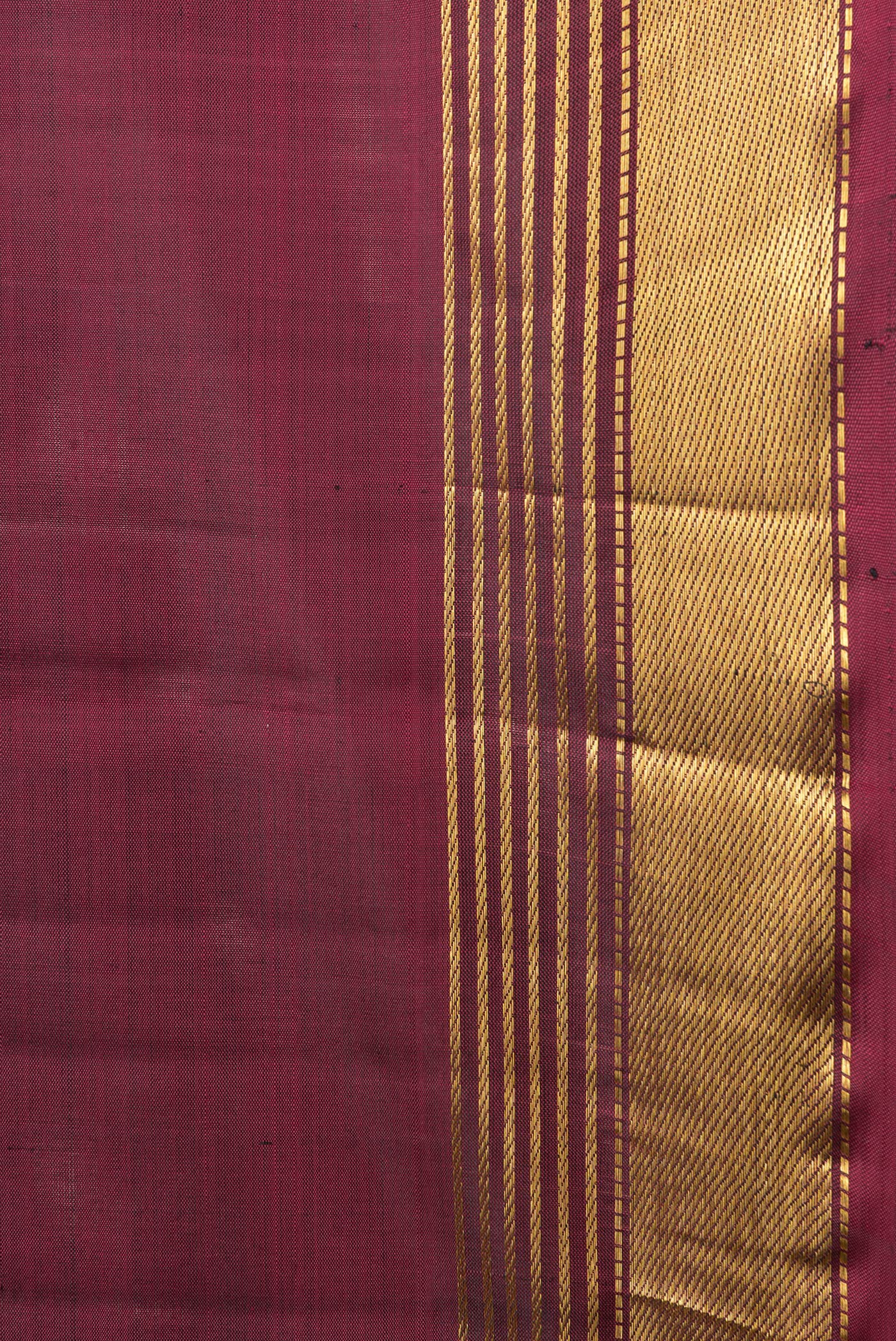 Border image of Maroon Dual Tone Kanjivaram Silk Saree with Plain Body and Zari Border. 