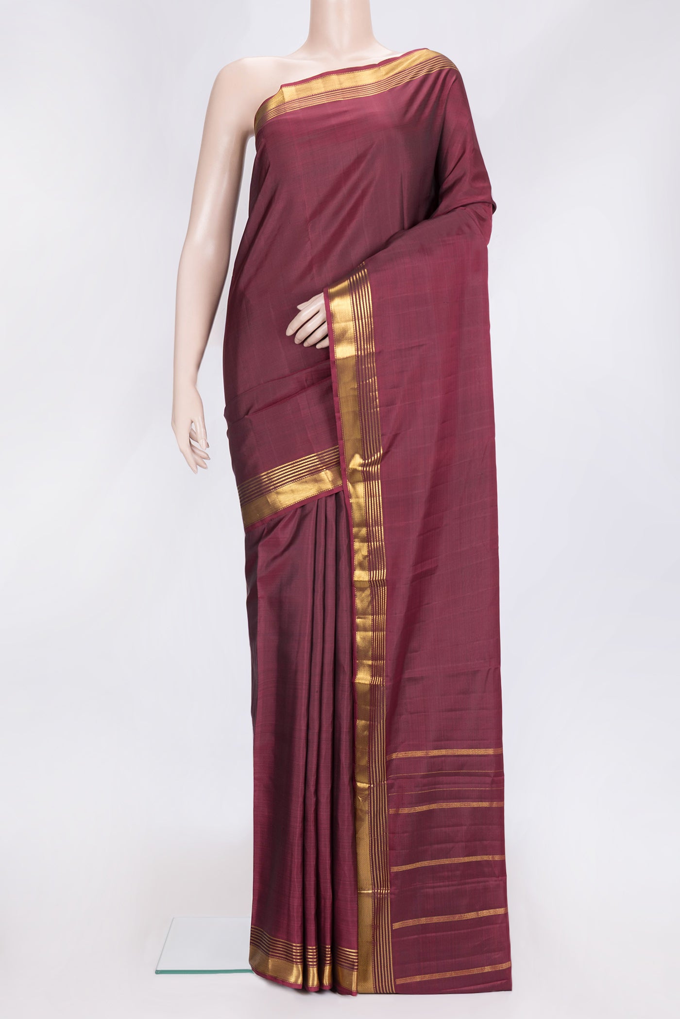 Maroon Dual Tone Kanjivaram Silk Saree with Plain Body and Zari Border.  displayed on a mannequin