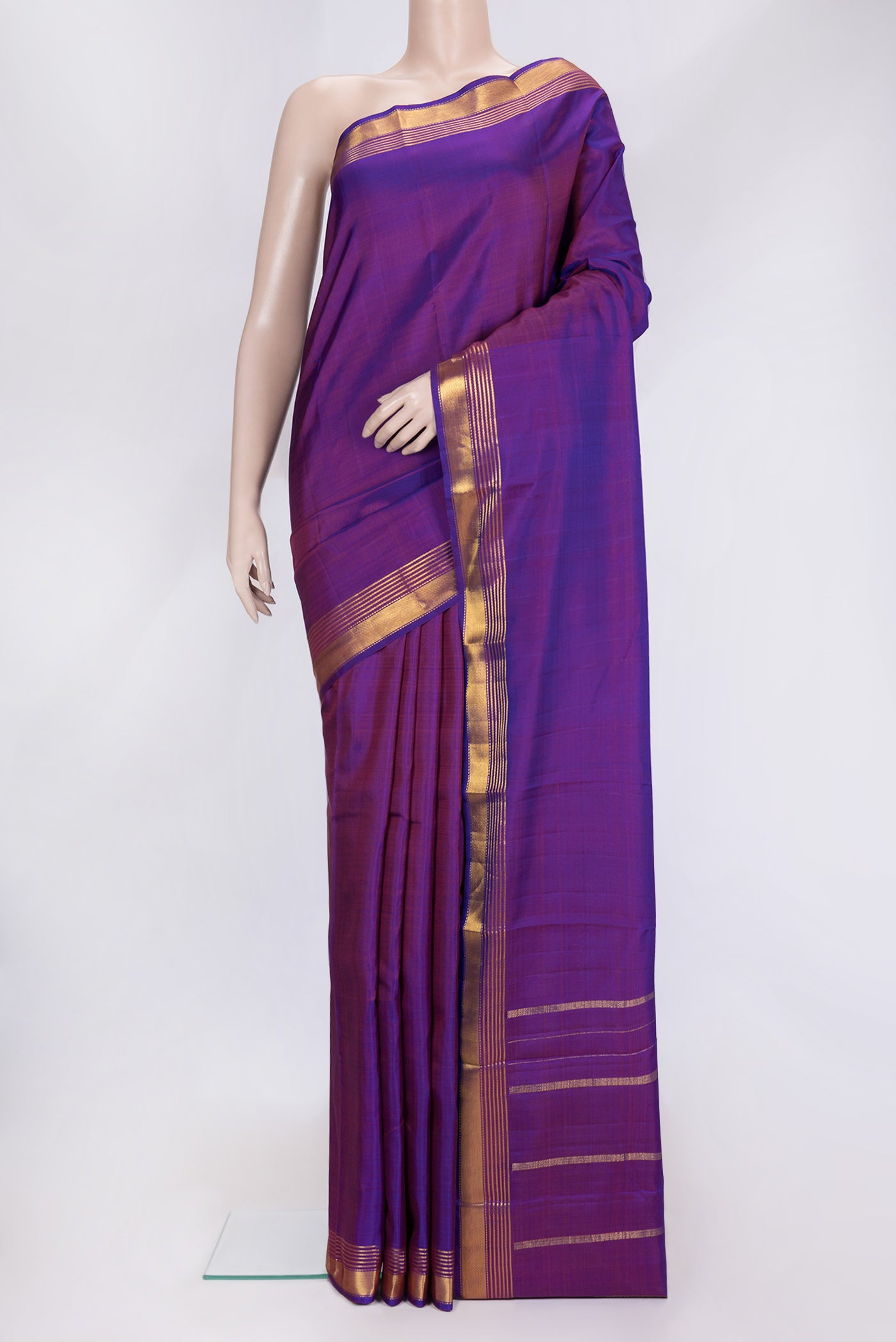 Purple Dual Tone Kanjivaram Silk Saree with Plain Body and Zari Border.  displayed on a mannequin