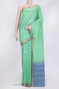 Sea Green Dual Tone Kanjivaram Silk Saree with Plain Body and Zari Border.  displayed on a mannequin