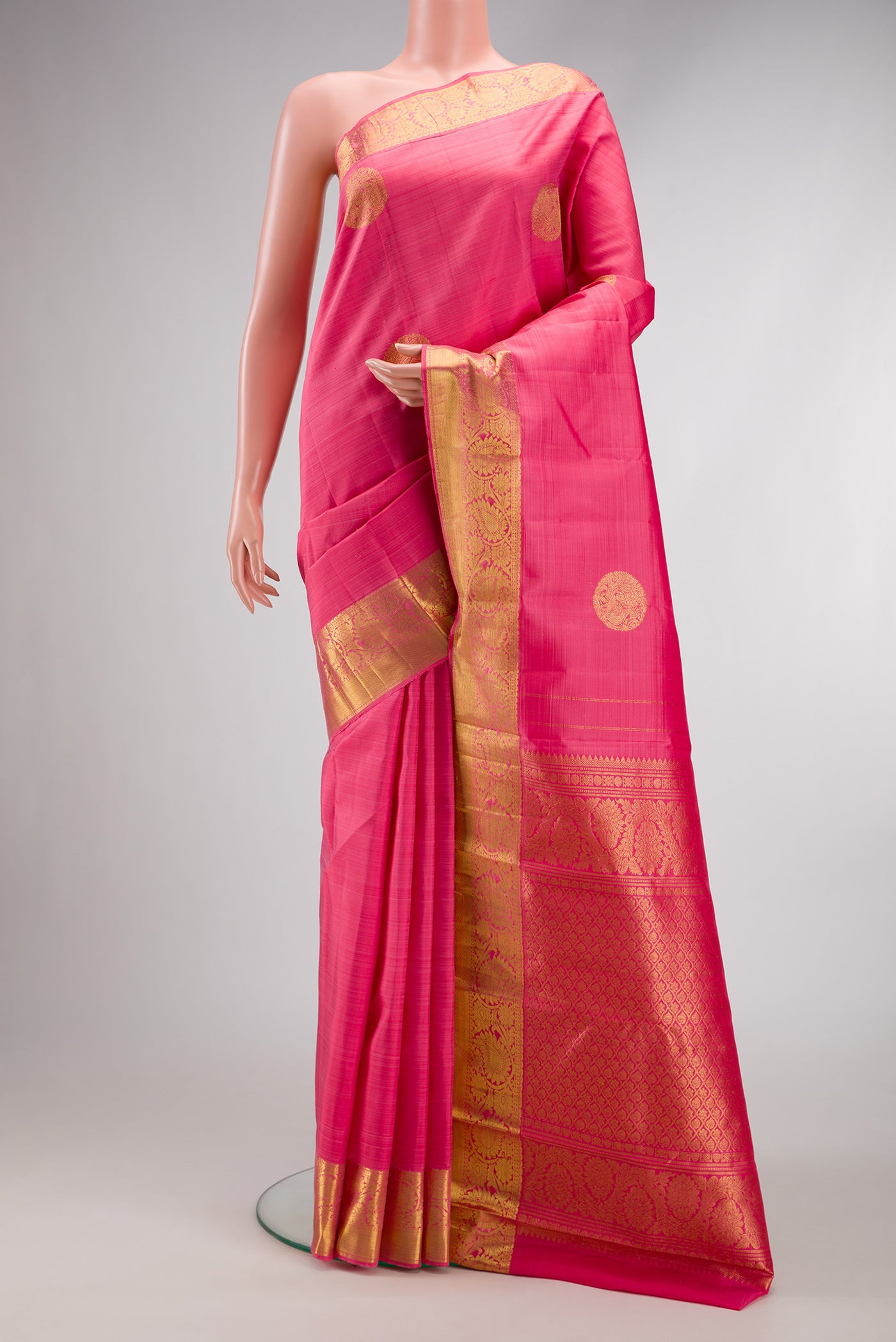 Pink Dual Tone Kanjivaram Silk Saree with Zari Butta on the body and Zari Border.  displayed on a mannequin