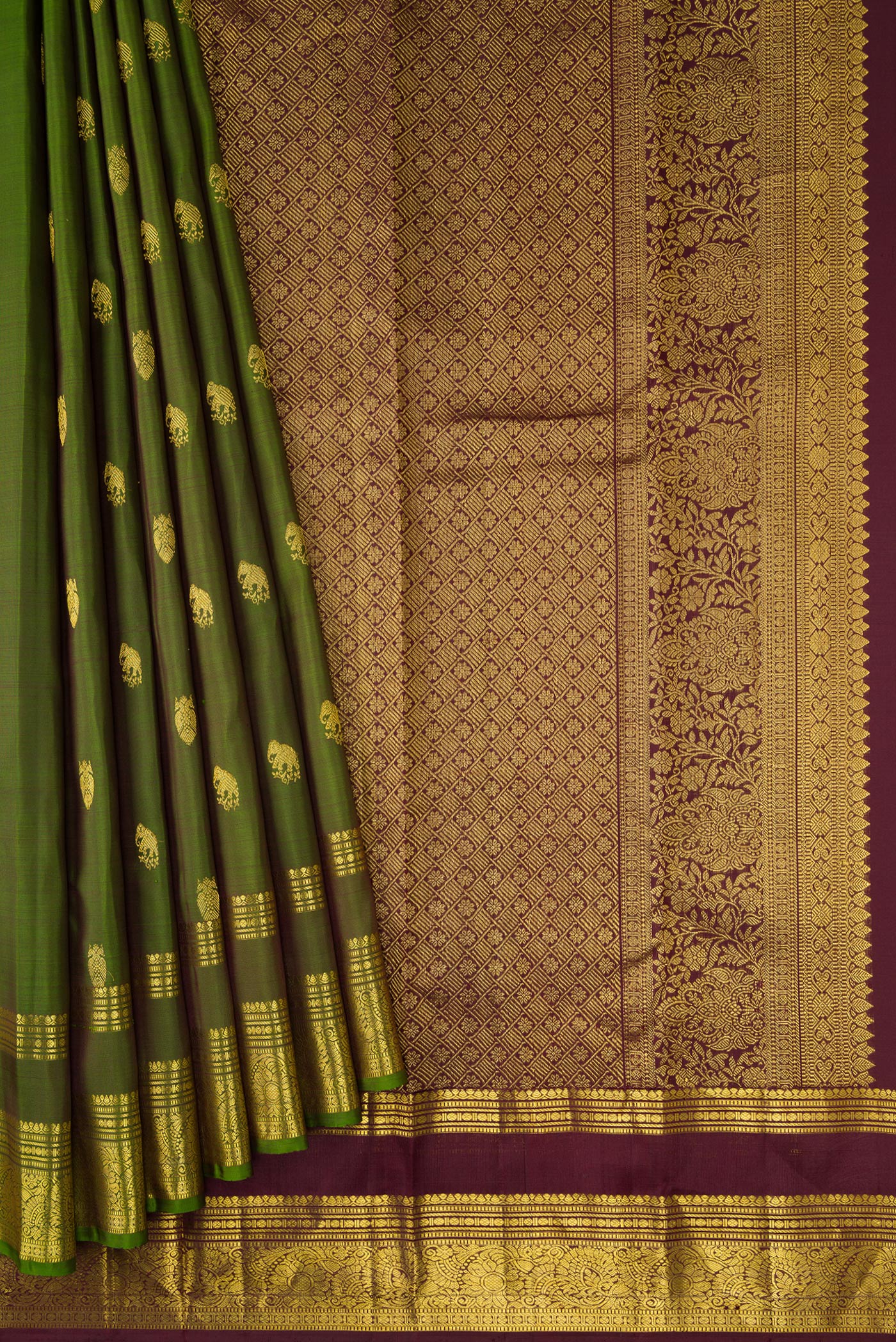 Pleats and pallu of Green Dual Tone Kanjivaram Silk Saree with Zari Butta on the body and Zari Border. 