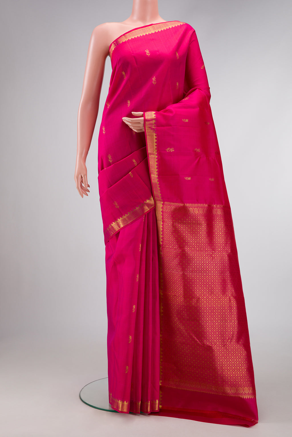 Pink Dual Tone Kanjivaram Silk Saree with Zari Butta on the body and Zari Border.  displayed on a mannequin