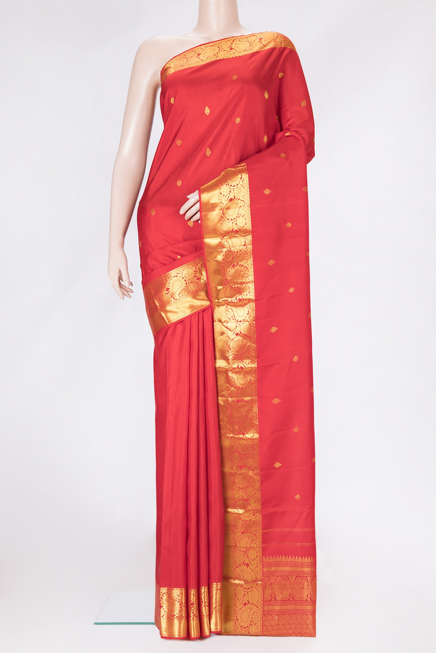 Red Dual Tone Kanjivaram Silk Saree with Zari Butta on the body and Zari Border.  displayed on a mannequin