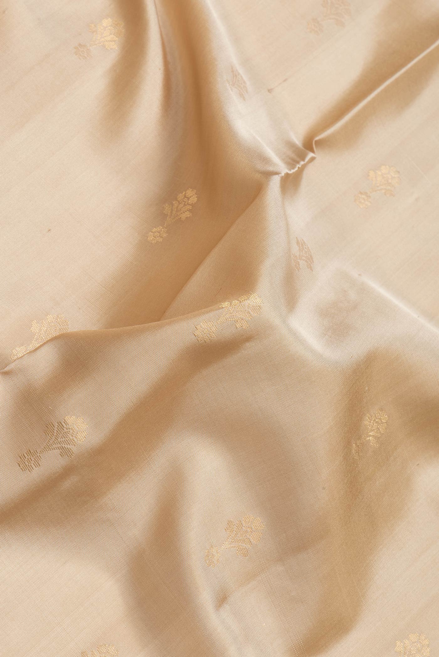 Close up of Sandal Dual Tone Soft Silk Saree with Zari Butta on the body and Zari Border.  displaying folds